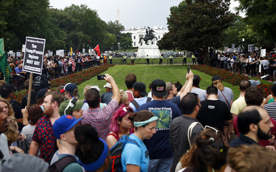 Demonstrators rally near the White House Sunday on the anniversary of the Charlottesville "Unite the Right" rally. (Jacquelyn Martin/AP)