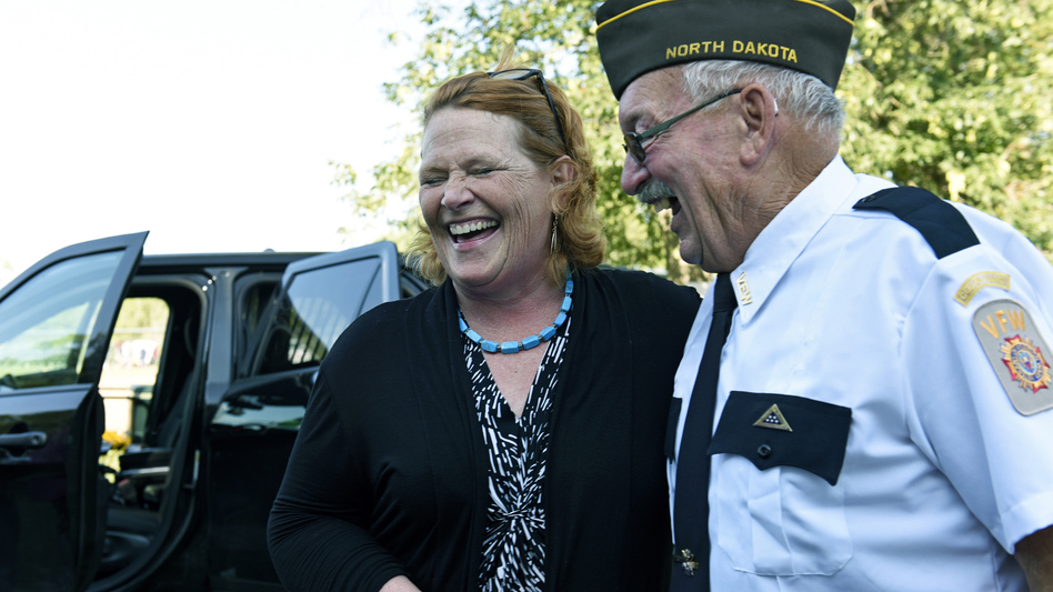 Sen. Heidi Heitkamp, D-N.D., laughs with an attendee at an event sponsored by the West Fargo Police Department on Aug. 7. Heitkamp is one of 10 Senate Democrats facing re-election in November in states President Donald Trump won in 2016. (Dan Koeck/Bloomberg via Getty Images)