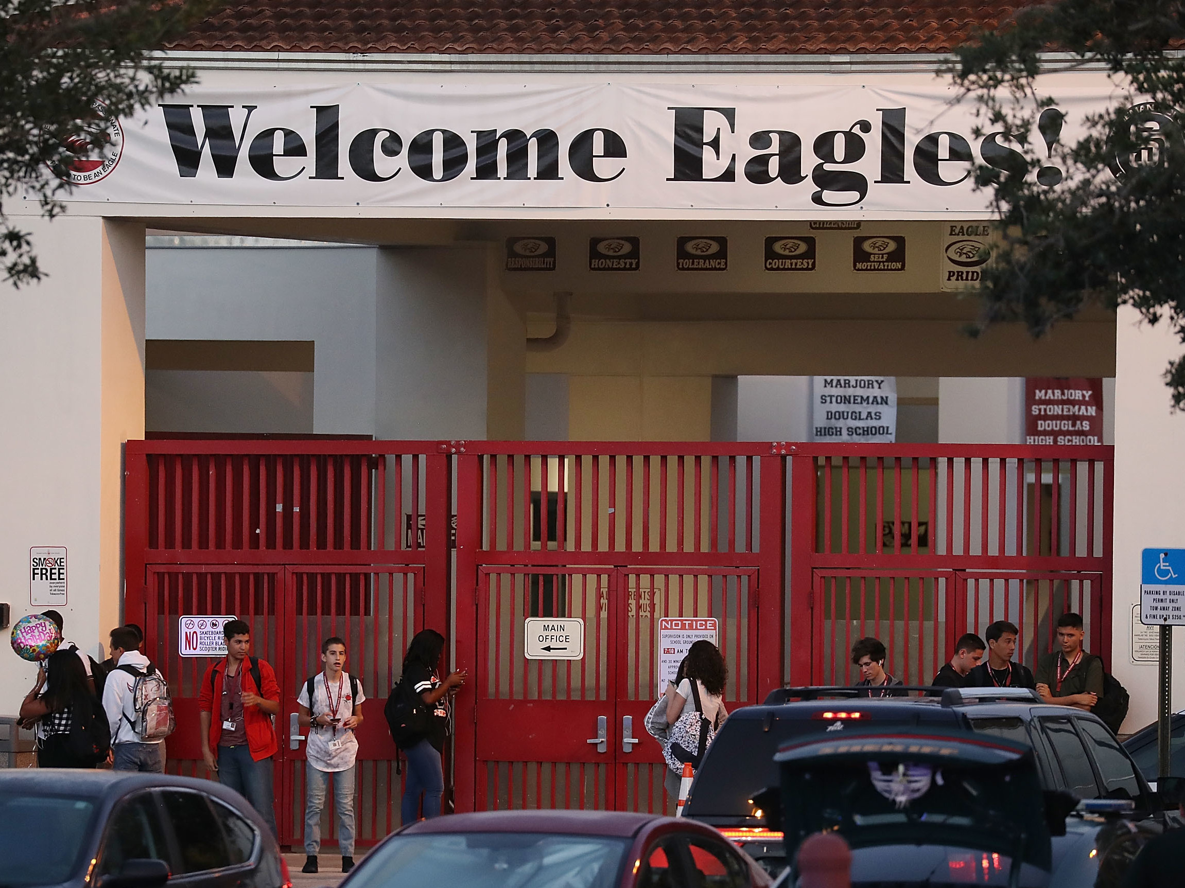 Students arrive Wednesday for their first day back at Marjory Stoneman Douglas High School, six months after the fatal shootings of Feb. 14. (Getty Images)