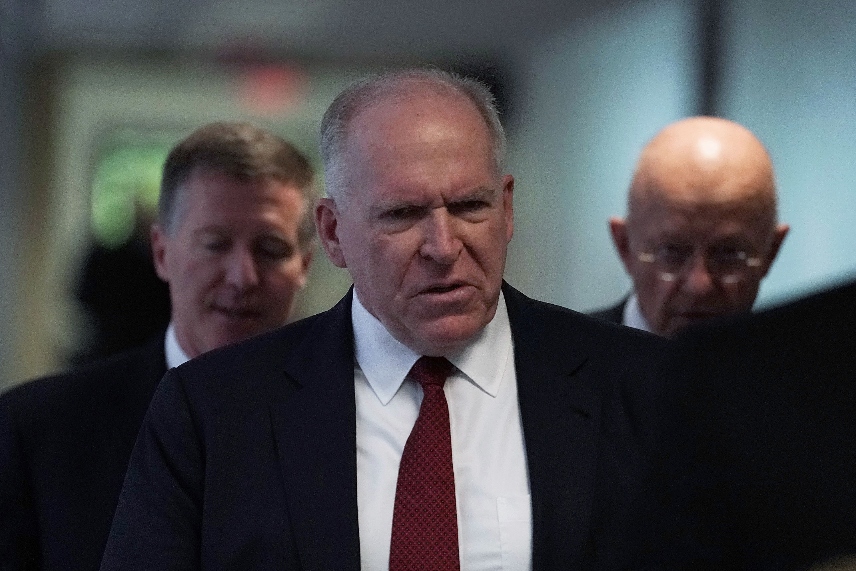 Former CIA Director John Brennan arrives at a May 2018 Senate hearing. President Trump revoked Brennan's security clearance Wednesday, claiming Brennan was acting &quot;erratic.&quot; (Getty Images)