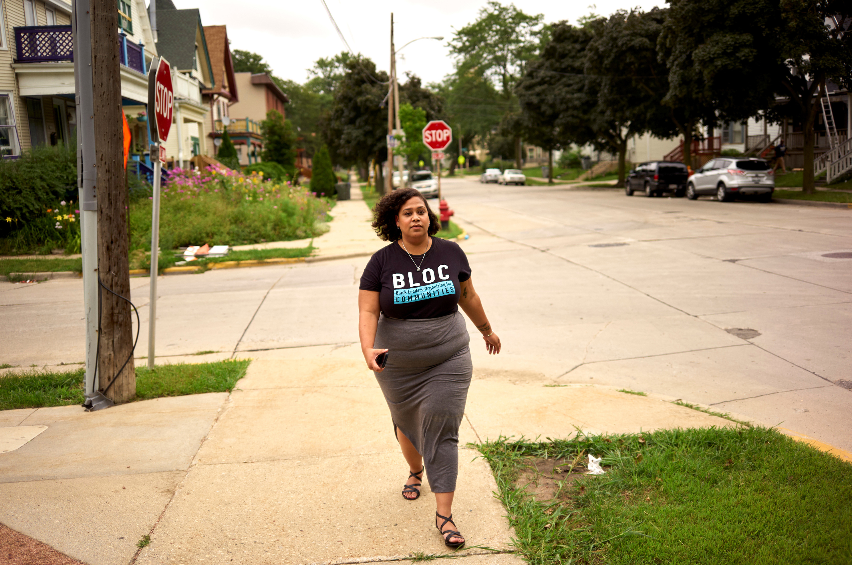 Angela Lang, left, executive director of BLOC, Black Leaders Organizing for Communities walks back to the organizations headquarters, Aug. 7, 2018 Milwaukee.
