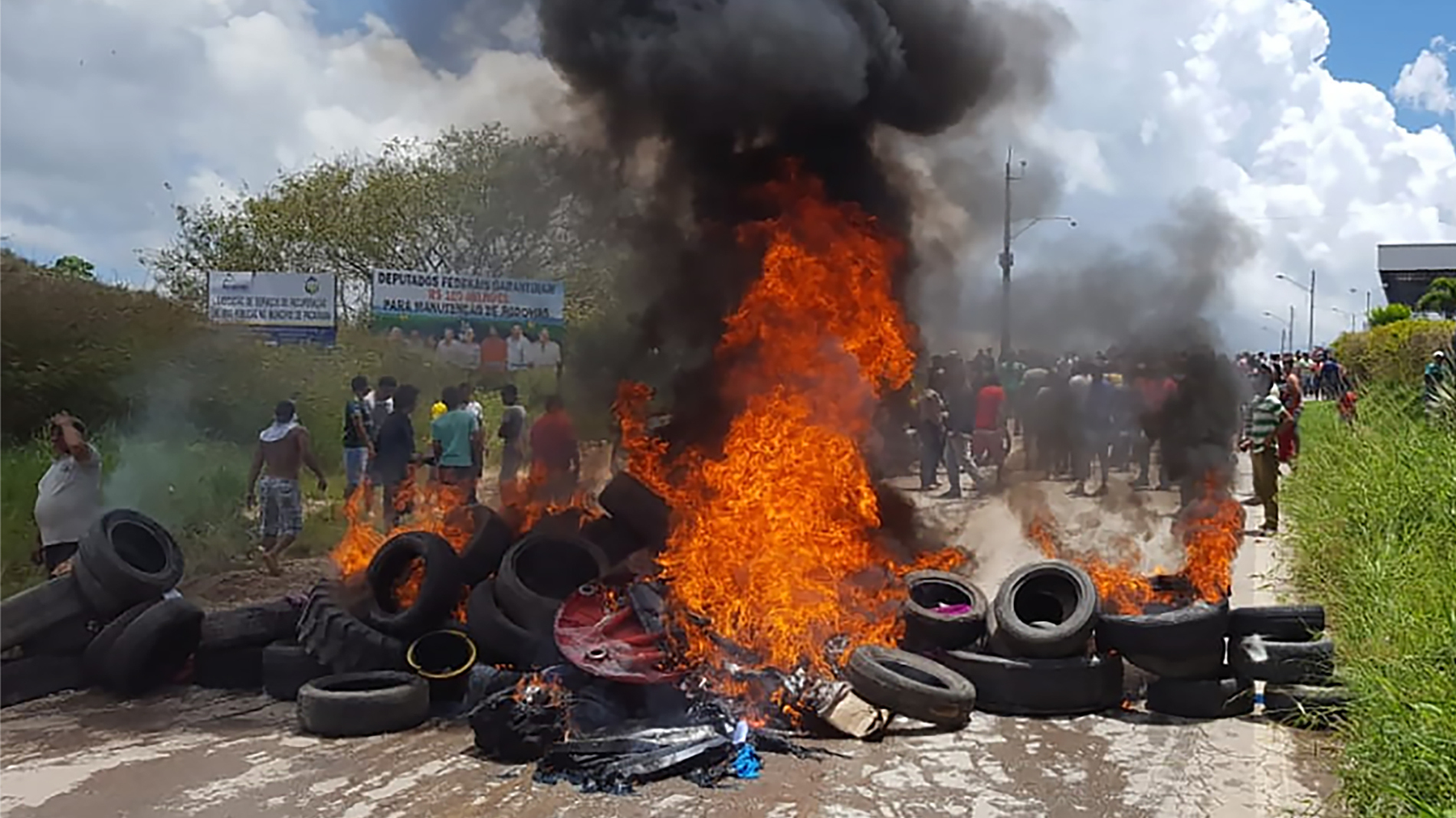 Residents of the Brazilian border town of Pacaraima burn tires and belongings of Venezuelan immigrants, after an attack on their makeshift camps. (AFP/Getty Images)