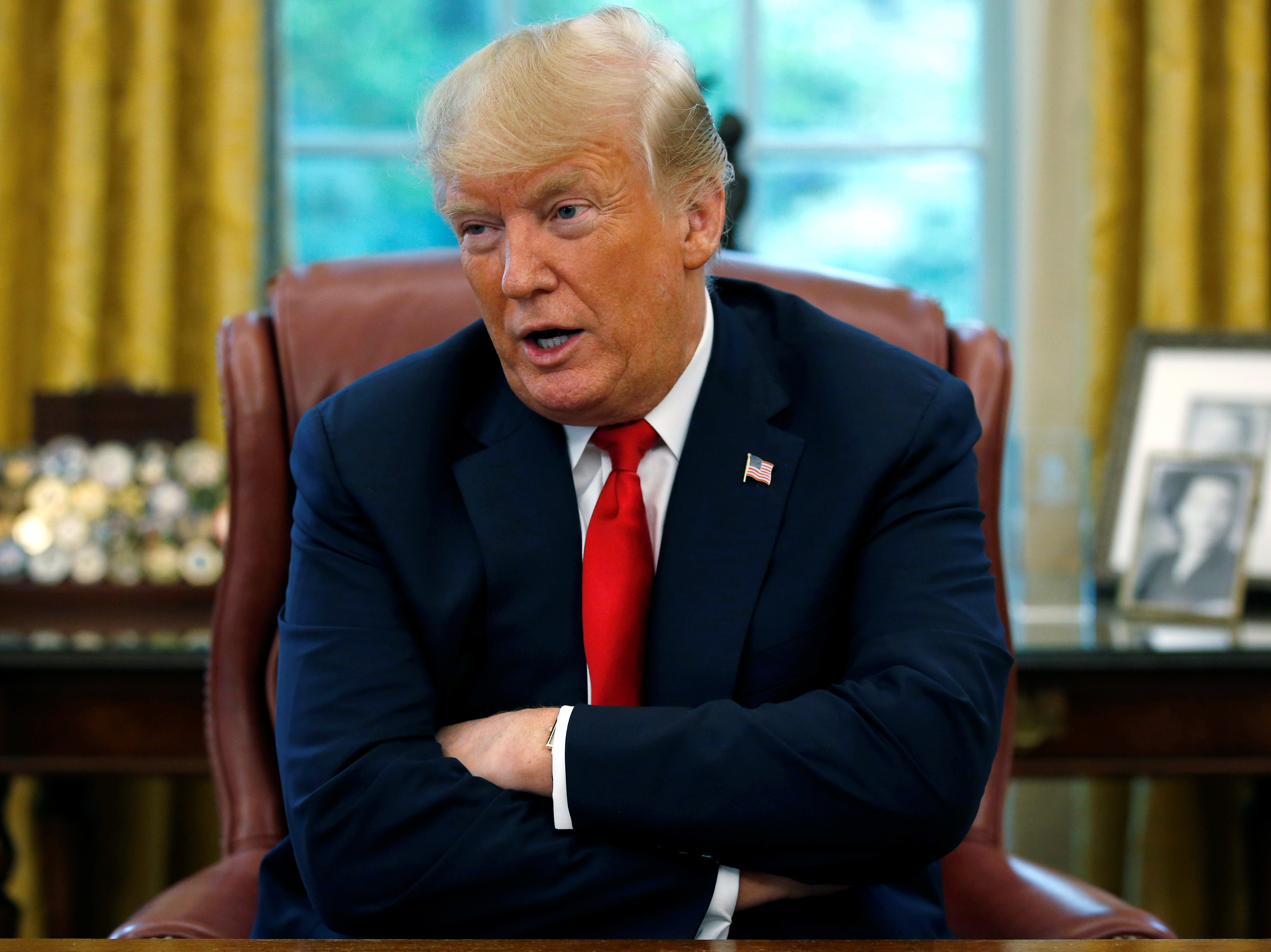 President Trump answers a question during a Reuters interview in the Oval Office on Monday. The president again criticized the Fed for raising interest rates. (Reuters)