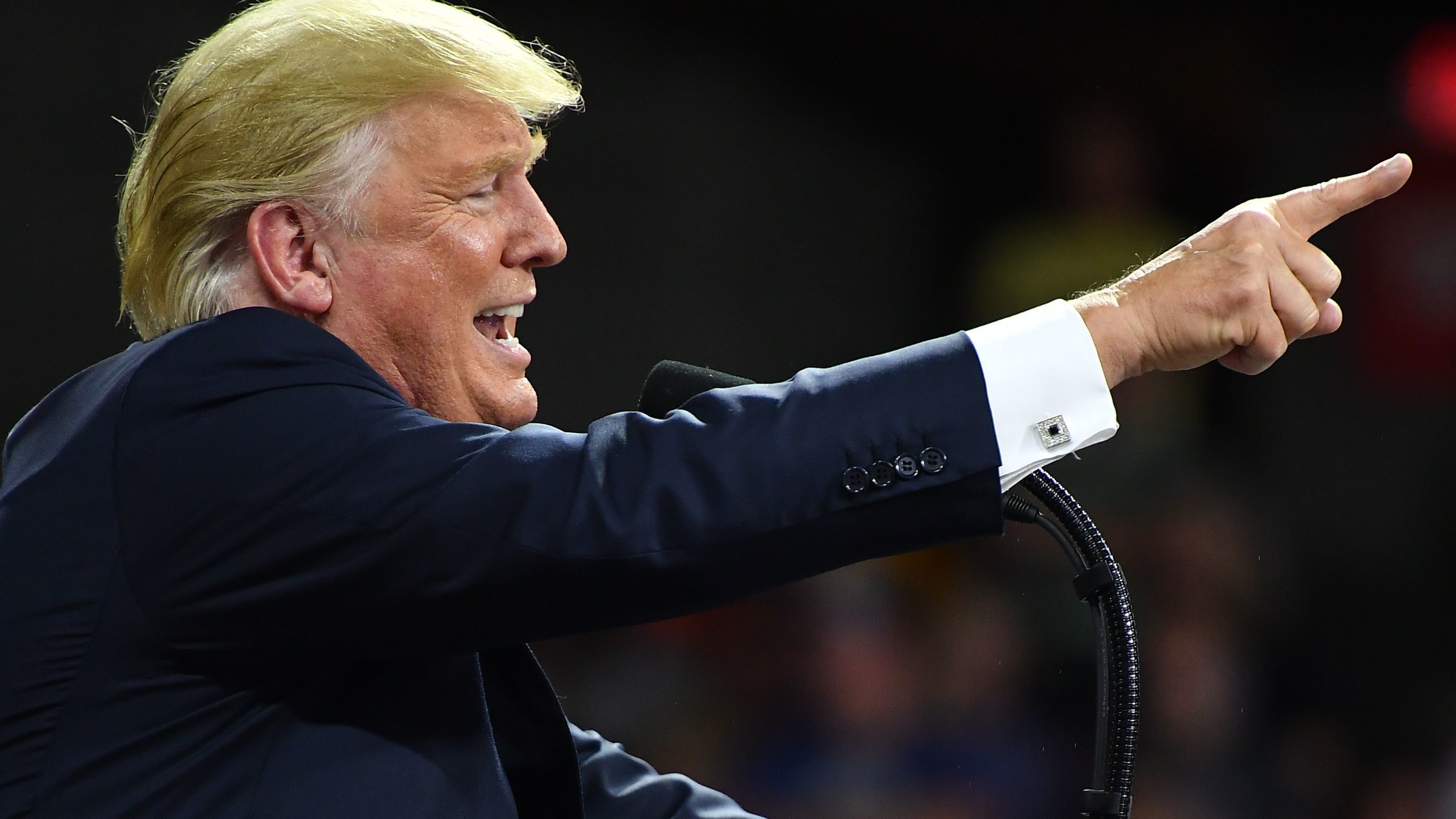 President Trump held a rally Tuesday night but waited until Wednesday to respond to the legal troubles of two close associates. (AFP/Getty Images)