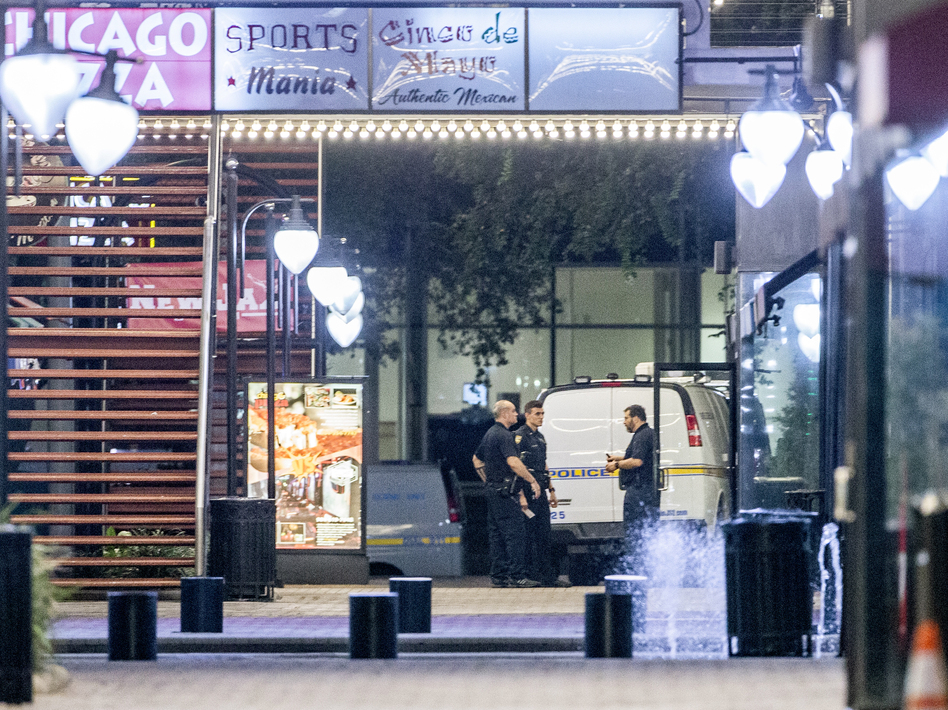A heavy police presence remained into the night at the scene of the shooting inside Jacksonville Landing on Sunday in Jacksonville, Fla. (Mark Wallheiser/Getty Images)