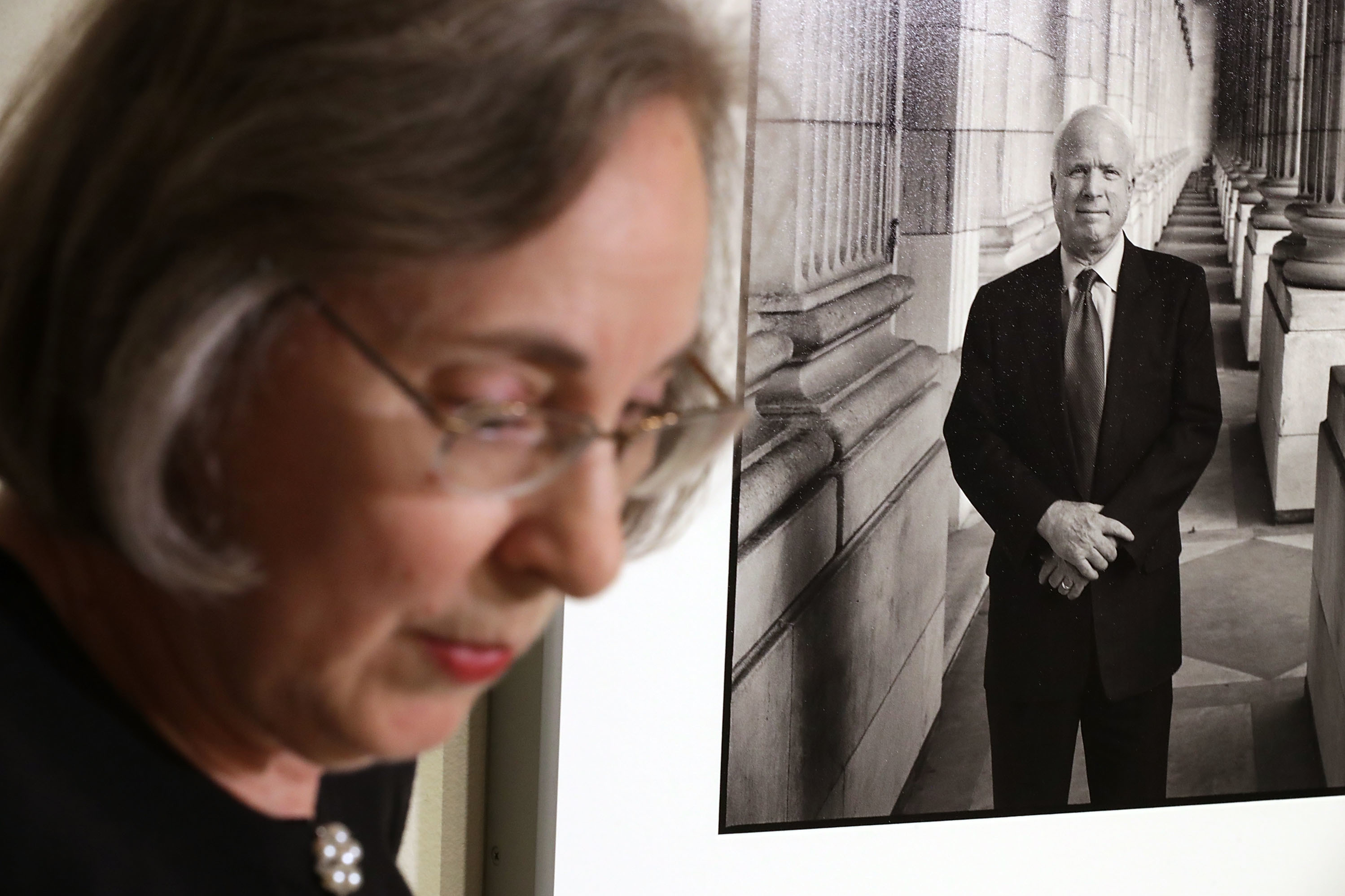 Smithsonian National Portrait Gallery curator Ann Shumard talks about a photograph of Sen. John McCain, R-Ariz., that was displayed at the gallery on Monday. The former presidential candidate died Saturday of brain cancer at the age of 81. This is the first time that the 2005 image of McCain by photographer Steve Pyke has been displayed in the gallery. (Getty Images)