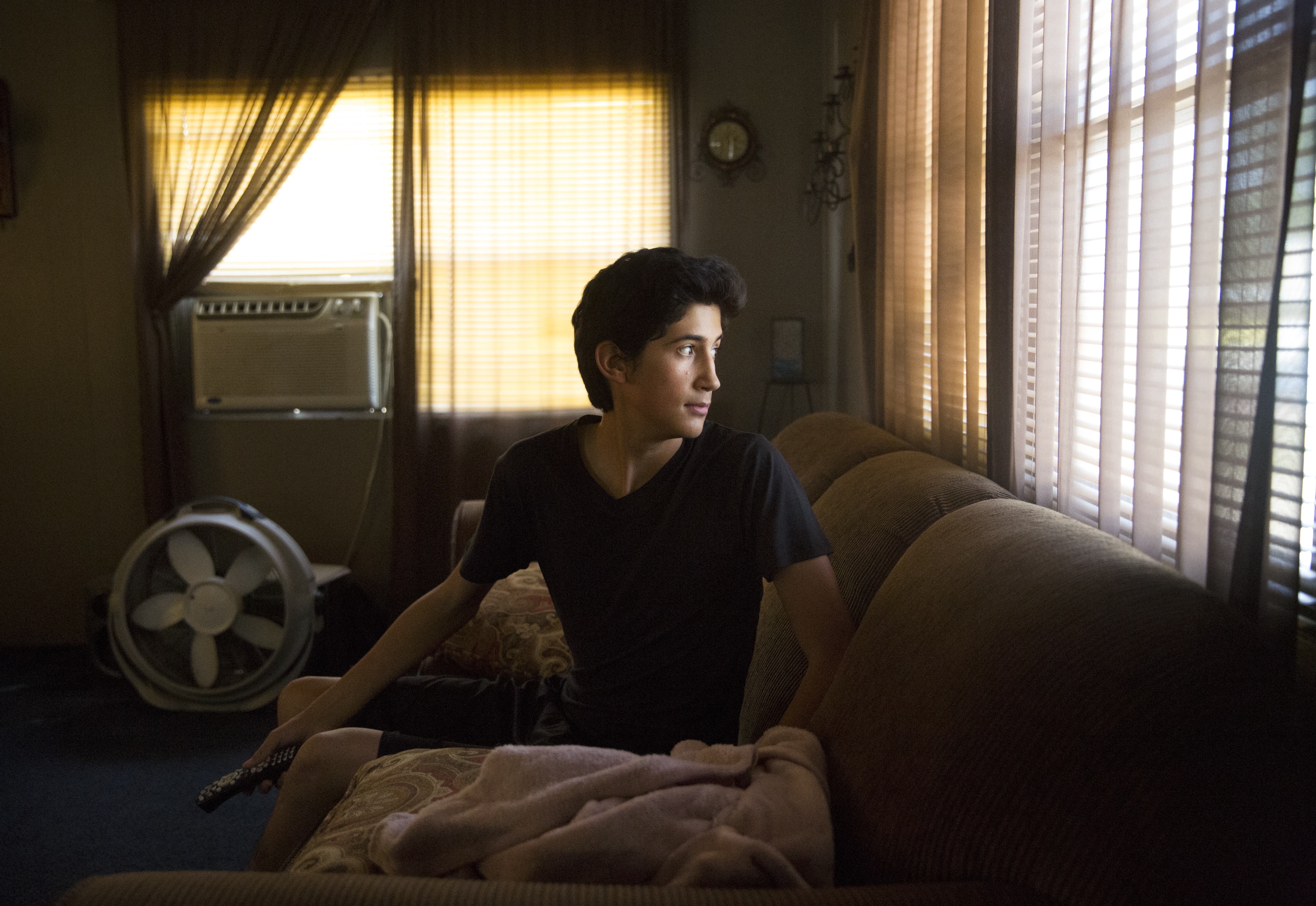 In One Generation, A Farmworker Family Grows College Ambitions 10 Angel waits for his father to get home from work.