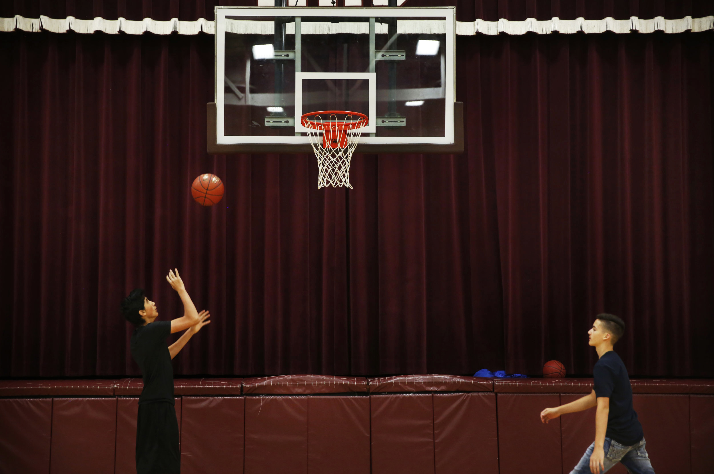 In One Generation, A Farmworker Family Grows College Ambitions 5 Angel plays basketball before starting the school day in Minto.