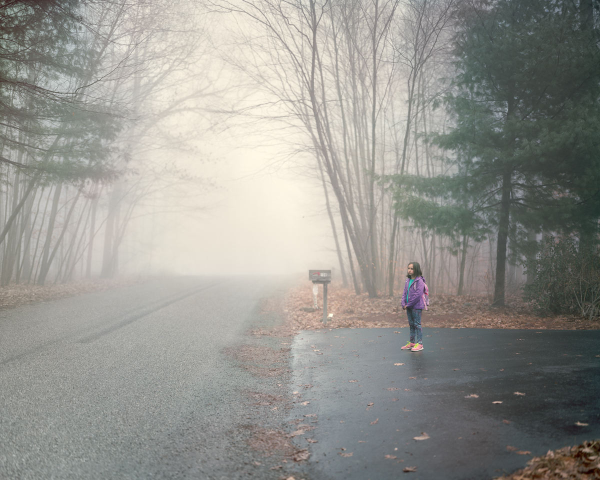 Photographer Greg Miller's daughter waits for her morning bus. He says of the project: &quot;My intention was to take something that is universal, an experience we all have had either as a child ourselves or as a parent of a child. ... My hope is that these pictures will communicate something that words can't.&quot; (Greg Miller)