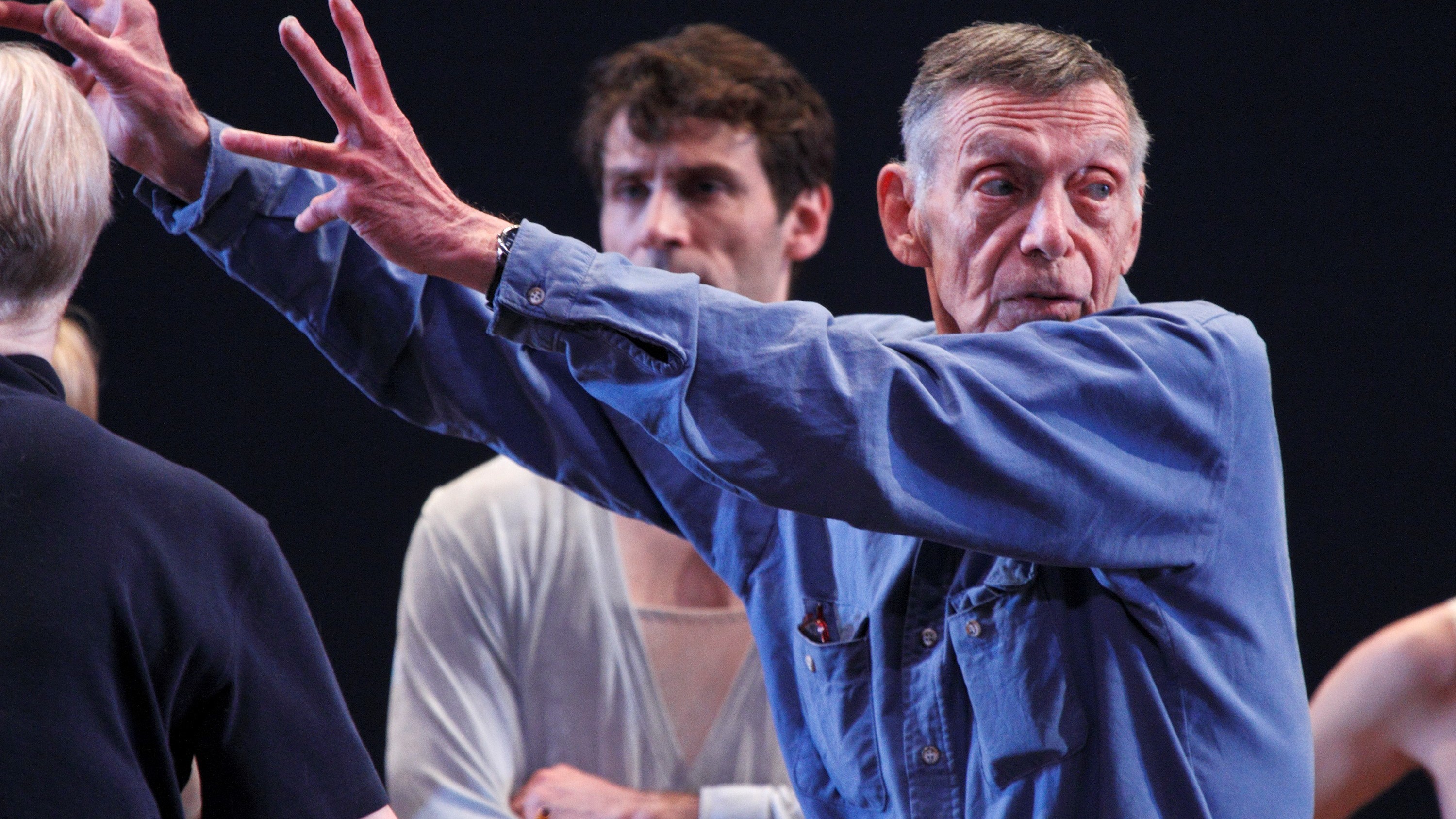 Paul Taylor, seen here directing the dance company that bears his name, left his major mark on the dance world as a choreographer.