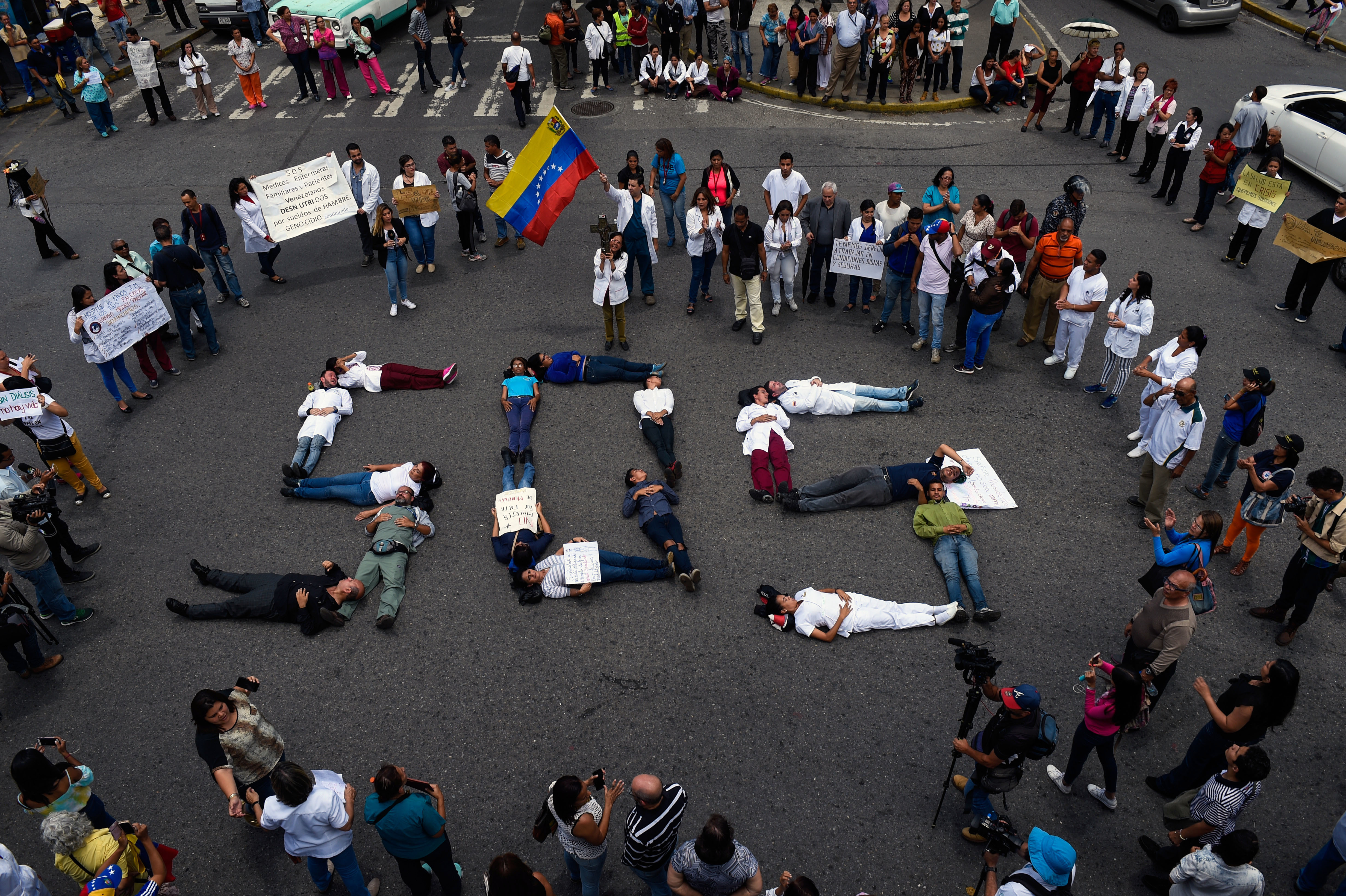 Health workers form a human chain reading &quot;SOS&quot; during a protest for the lack of medicines, medical supplies and poor conditions in hospitals, in Caracas on Aug. 2. (AFP/Getty Images)