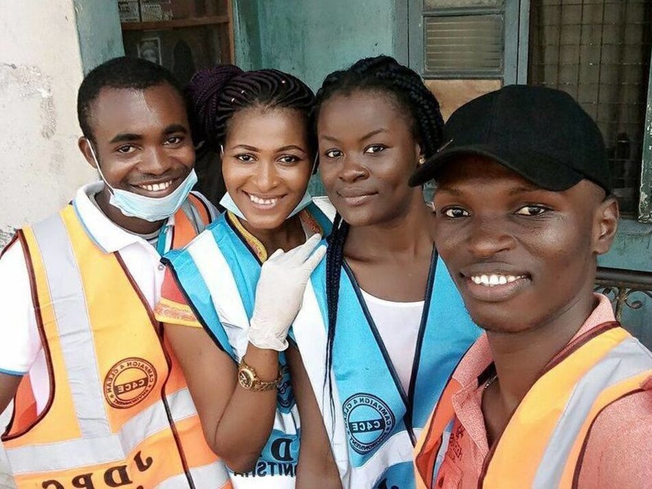 Chris Junior Anaekwe, right, with three volunteers. They picked up trash in their city of Onitsha, Nigeria, for World Environment Day on June 5. (Chris Junior Anaekwe)