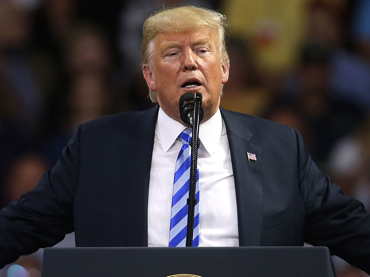 President Trump's top aides have wrought an elaborate system of schemes to keep him from taking actions they feared would hurt the country, according to accounts in a new book by Bob Woodward. (Getty Images)