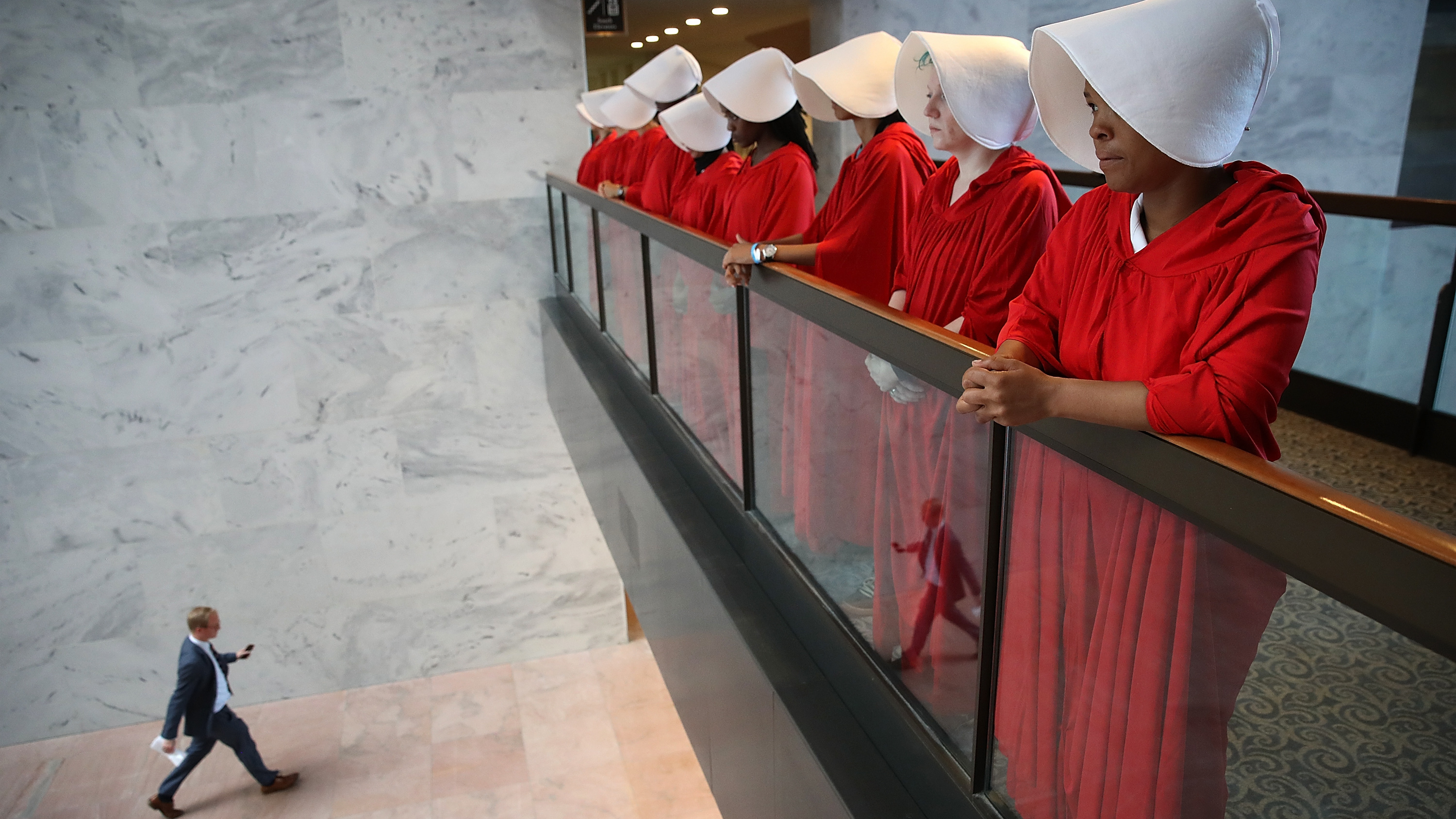 Protesters dressed as characters from <em>The Handmaid's Tale</em> outside the confirmation hearing for Brett Kavanaugh on Tuesday. (Getty Images)