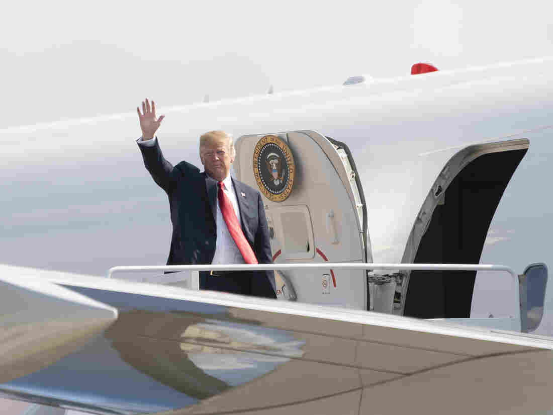 President Trump boards Air Force One headed for events in Illinois, Missouri and Iowa on July 26.