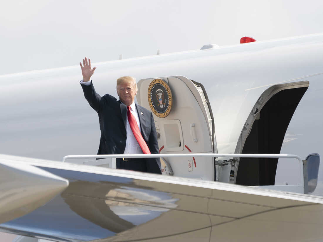 President Trump boards Air Force One headed for events in Illinois, Missouri and Iowa on July 26.