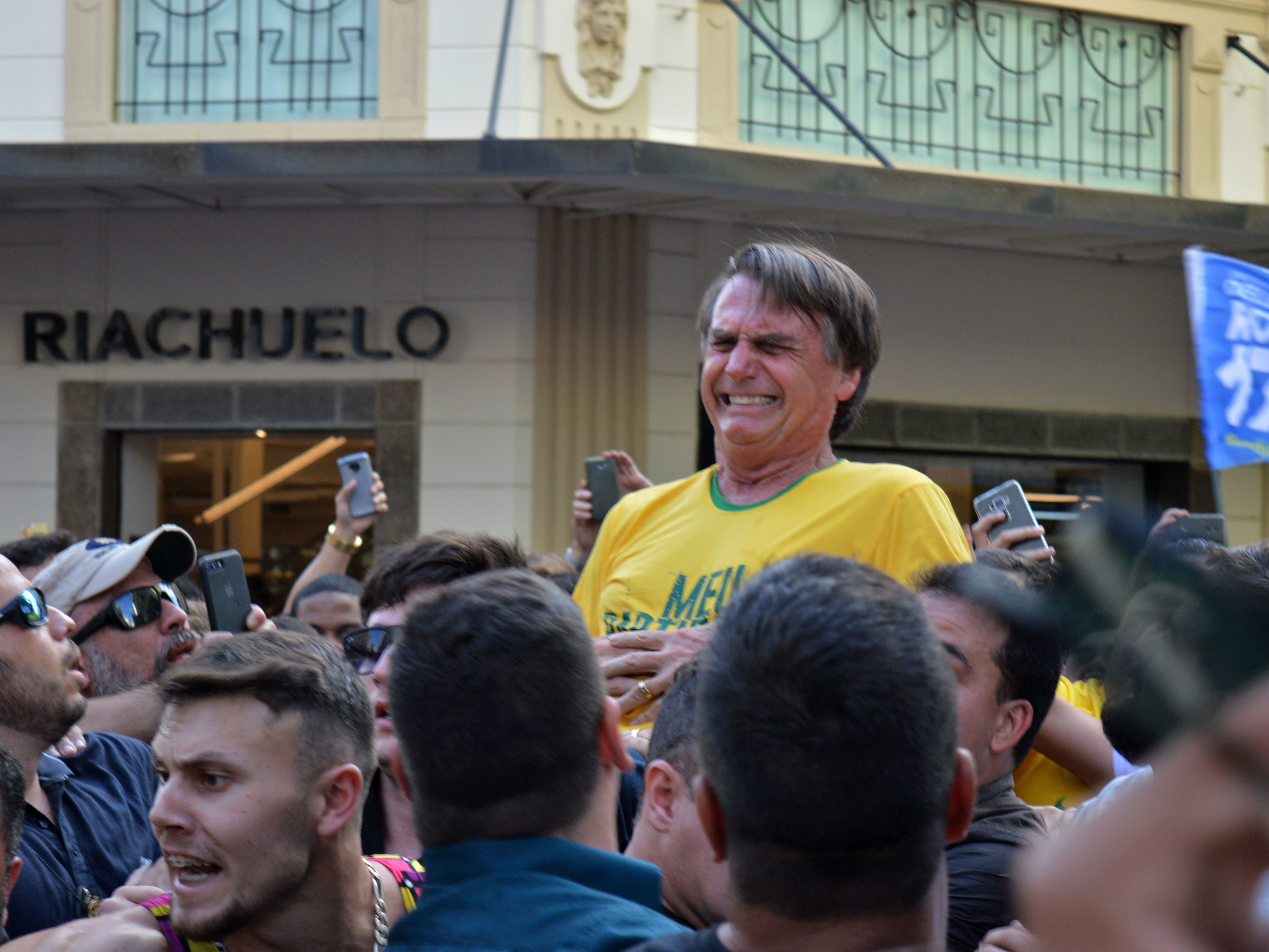 Brazilian right-wing presidential candidate Jair Bolsonaro gestures after being stabbed in the stomach during a campaign rally in Juiz de Fora, Minas Gerais state, in southern Brazil, on Thursday. (AFP/Getty Images)