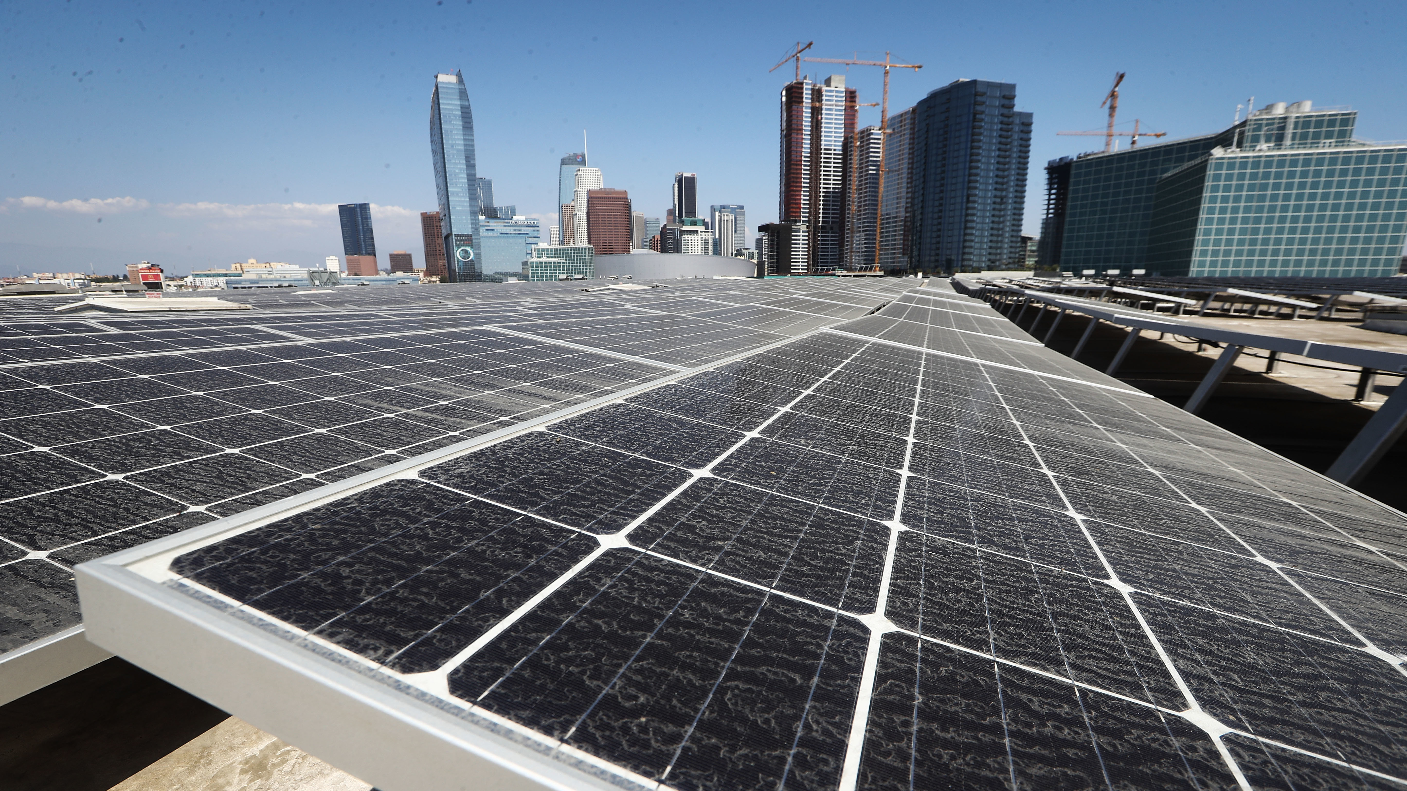 Solar panels are mounted on the roof of the Los Angeles Convention Center on September 5. The state's governor has signed a landmark bill setting a goal of 100 percent clean energy for the state's electrical needs, by the year 2045. (Getty Images)