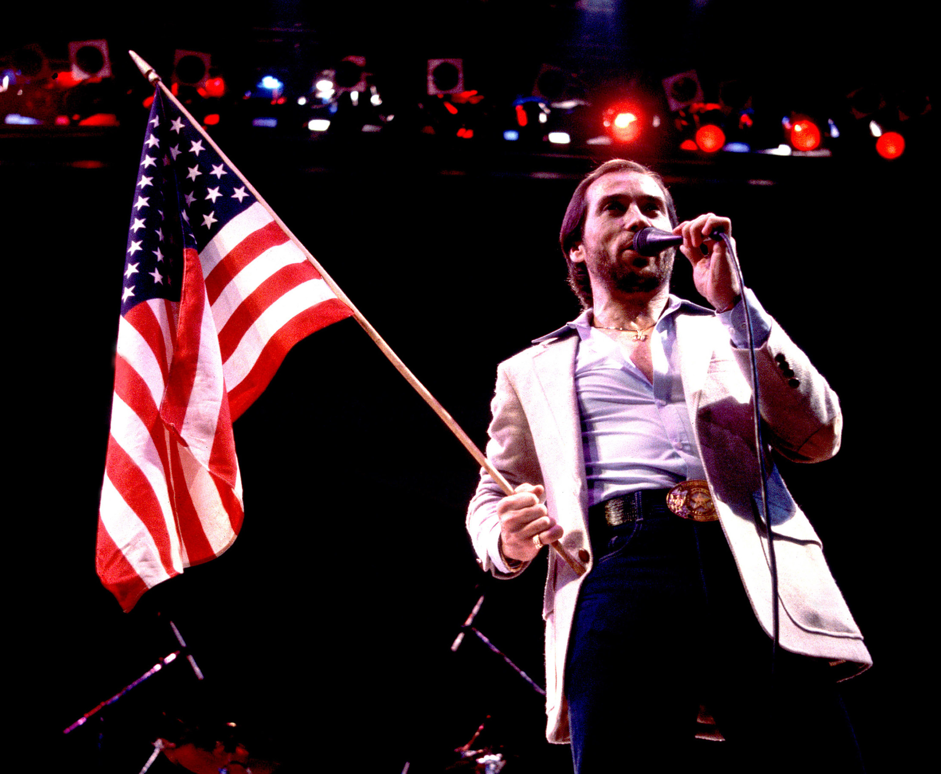 Lee Greenwood performs in Illinois in 1984. Released that spring to a modest chart showing, &quot;God Bless the U.S.A.&quot; found staying power as political campaigns began to adopt it. (Getty Images)