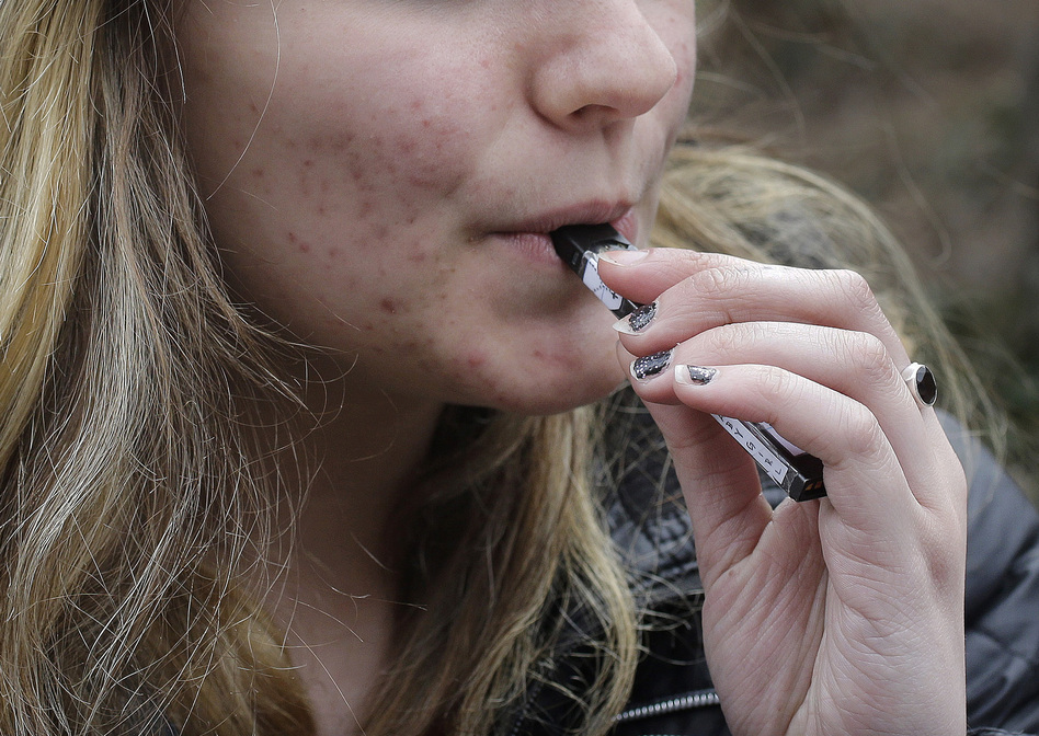 An unidentified 15-year-old student at a high school in Cambridge, Mass., vaped near campus in April.