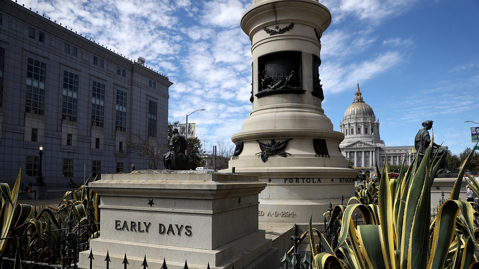 An empty pedestal remains where a statue known as <em>Early Days</em>, which depicted a Native American at the feet of a Catholic missionary and Spanish cowboy, used to stand on Fulton Street in San Francisco. The statue was removed early Friday morning.