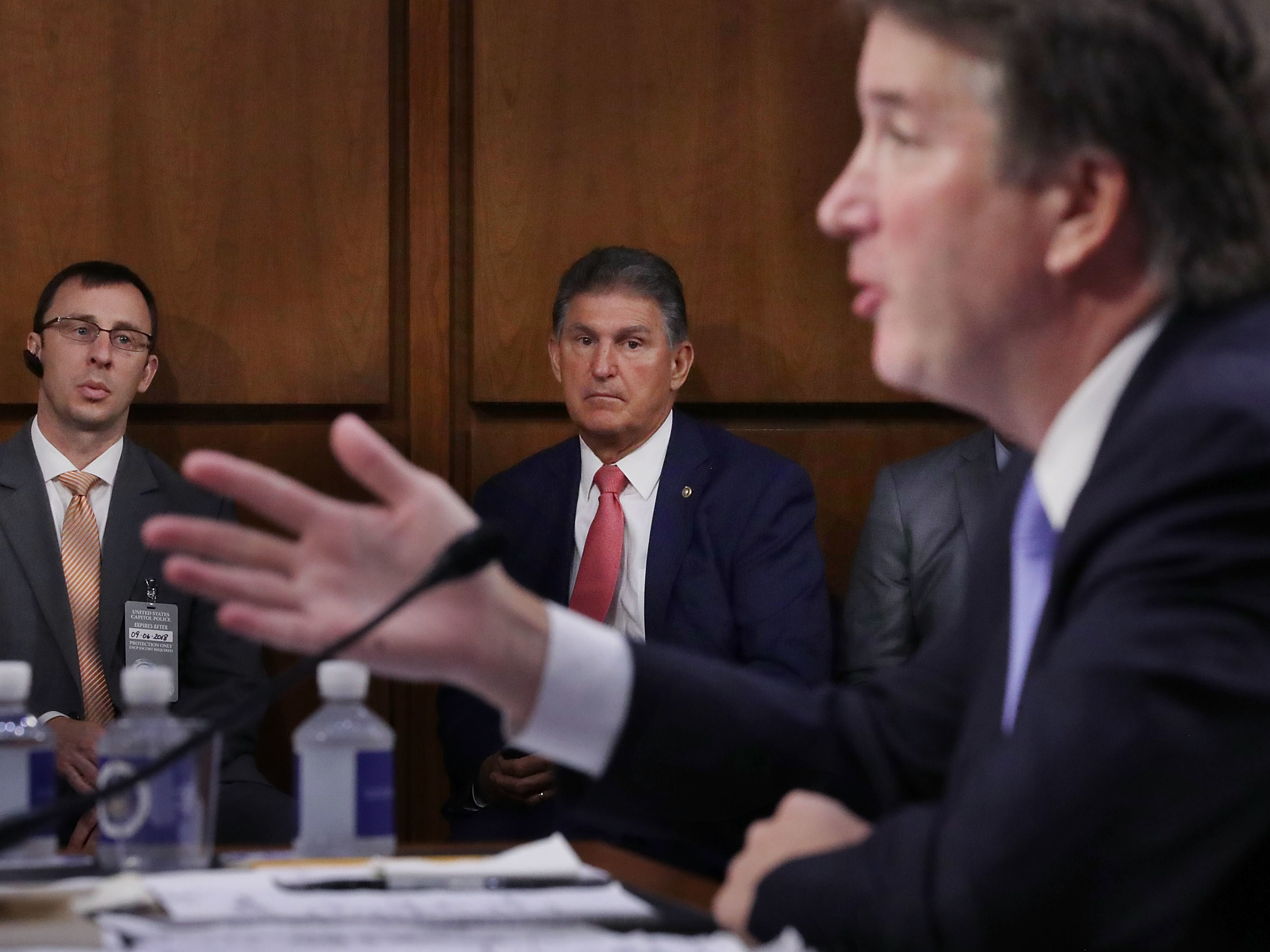 Sen. Joe Manchin, D-W.Va., listens to Supreme Court nominee Judge Brett Kavanaugh as he testifies before the Senate Judiciary Committee on Sept. 6. Running a tight re-election race in a conservative state, Manchin has faced pressure to support Kavanaugh. (Getty Images)