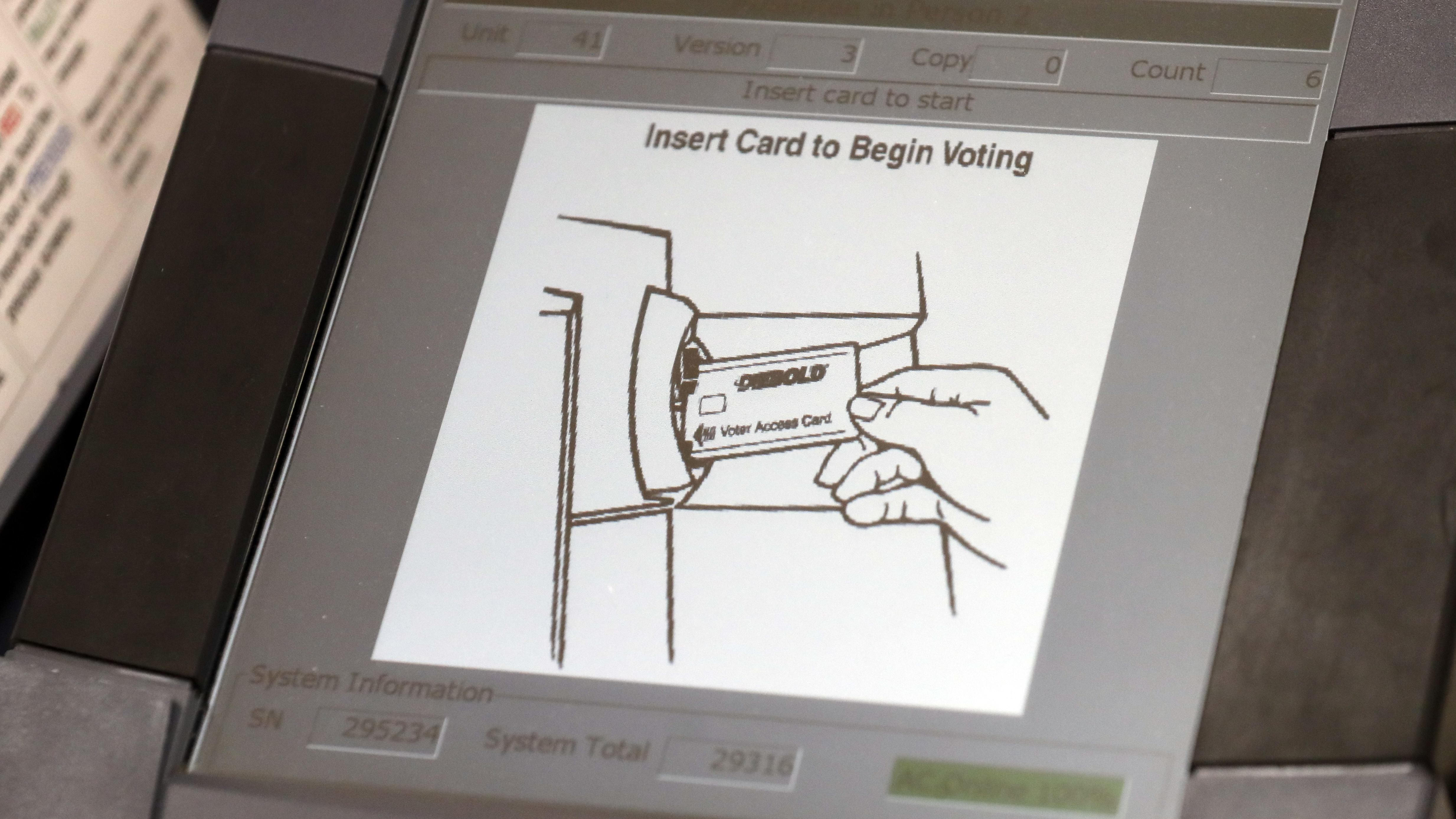 A touchscreen voting machine in Sandy Springs, Ga., during the primary election in May 2018. As the midterm congressional primaries heat up amid warnings of Russian hacking, about 1 in 5 Americans will be casting their ballots on machines that do not produce a paper record of their votes.