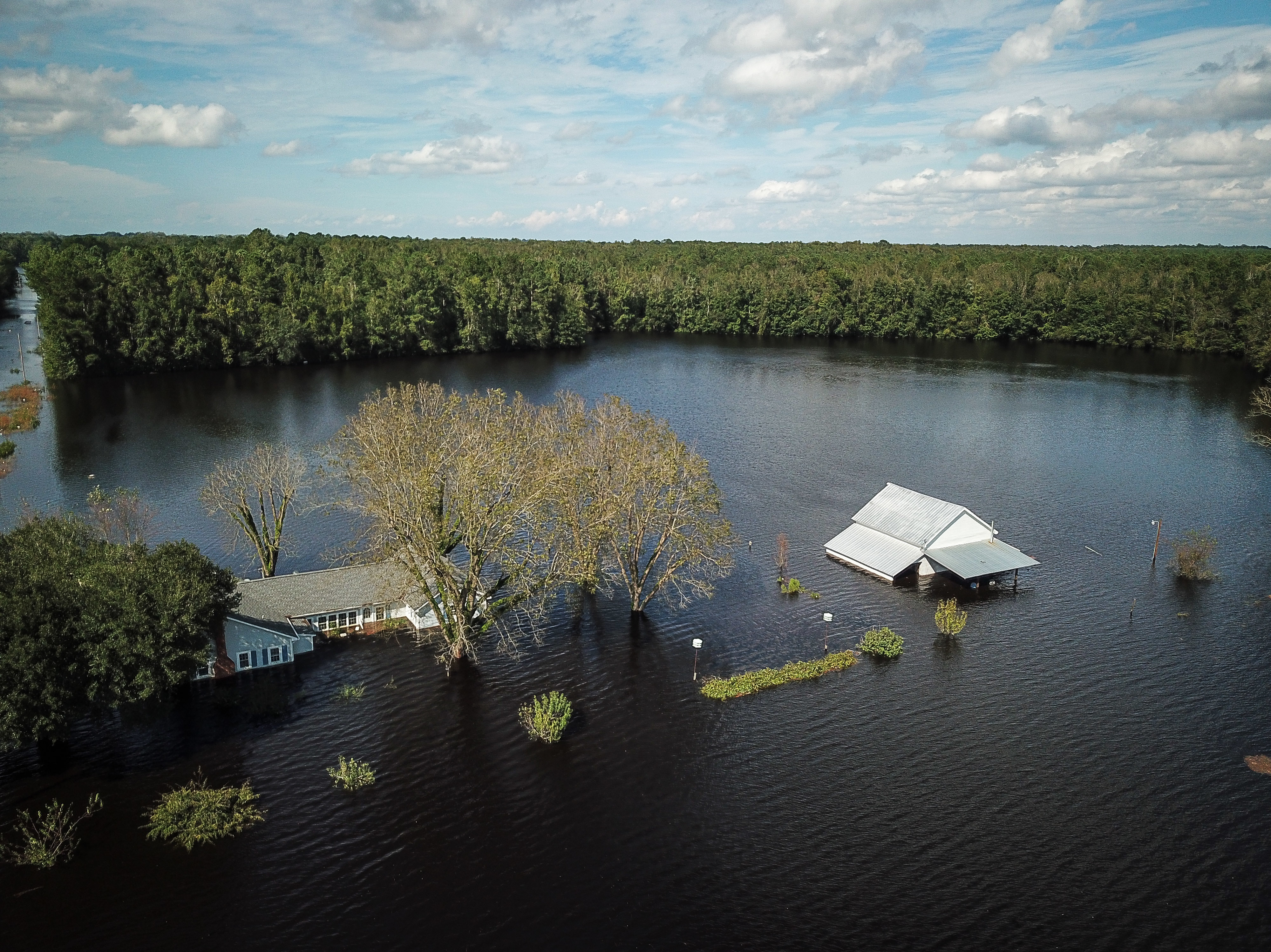 A flooded farm stands next to the Lumber River on Monday in this aerial photograph taken after Hurricane Florence hit Lumberton, N.C. (Bloomberg via Getty Images)