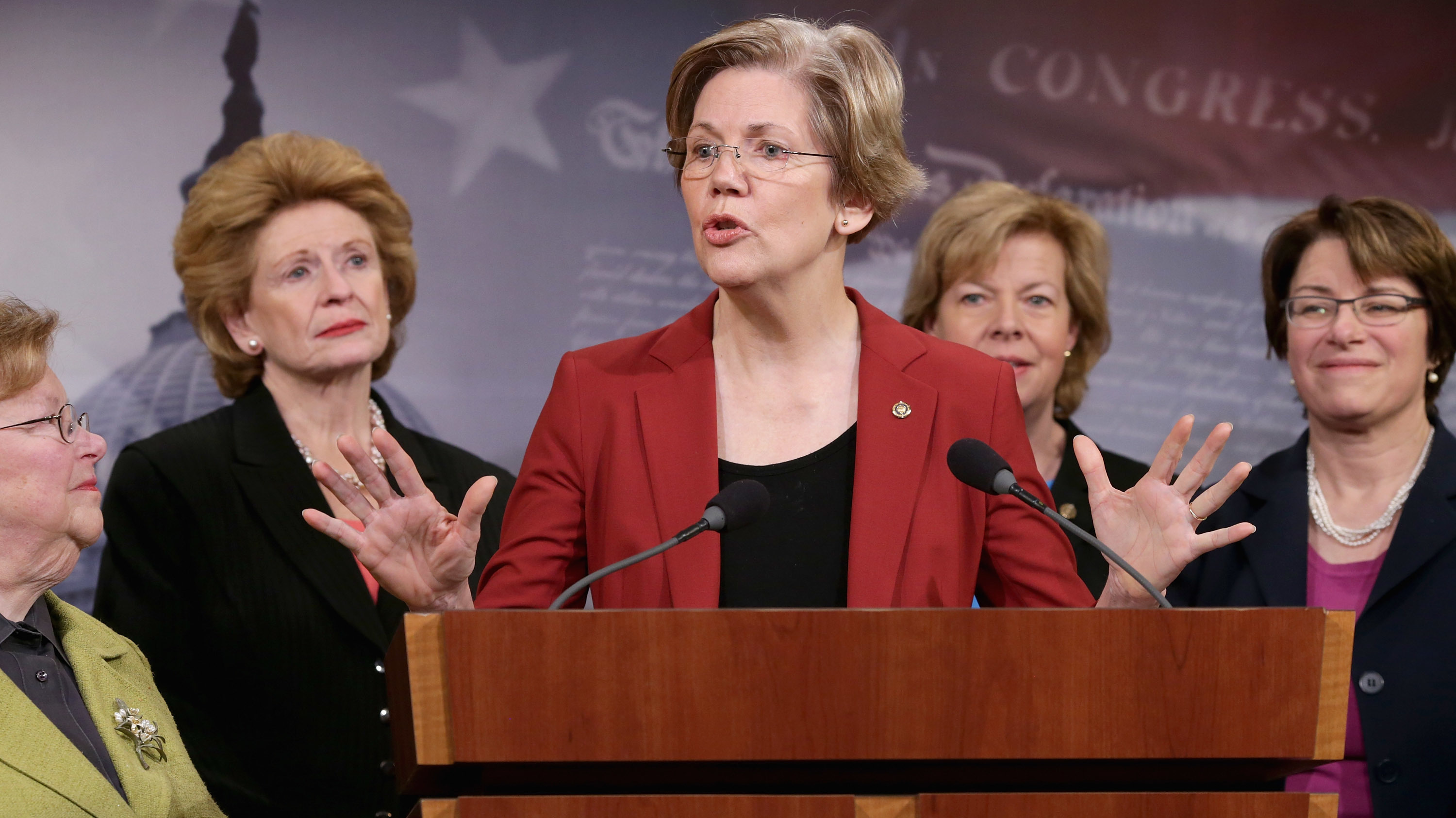 Former U.S. Sen. Barabara Mikulski (D-MD), U.S. Sen. Debbie Stabenow (D-MI), U.S. Sen. Elizabeth Warren (D-MA), U.S. Sen. Tammy Baldwin (D-WI) and U.S. Sen. Amy Klobuchar (D-MN) join other women Democratic senators for a news conference at the U.S. Capitol January 30, 2014. (Getty Images)