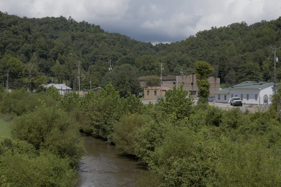 Rockcastle Creek flows past residential homes and businesses along Route 3 in the town of Inez in Martin County, Ky. People in Martin County still don't trust the tap water. The water issues in Martin County are multi-layered and it's hard to pinpoint exactly when they started. (Rich-Joseph Facun for NPR)