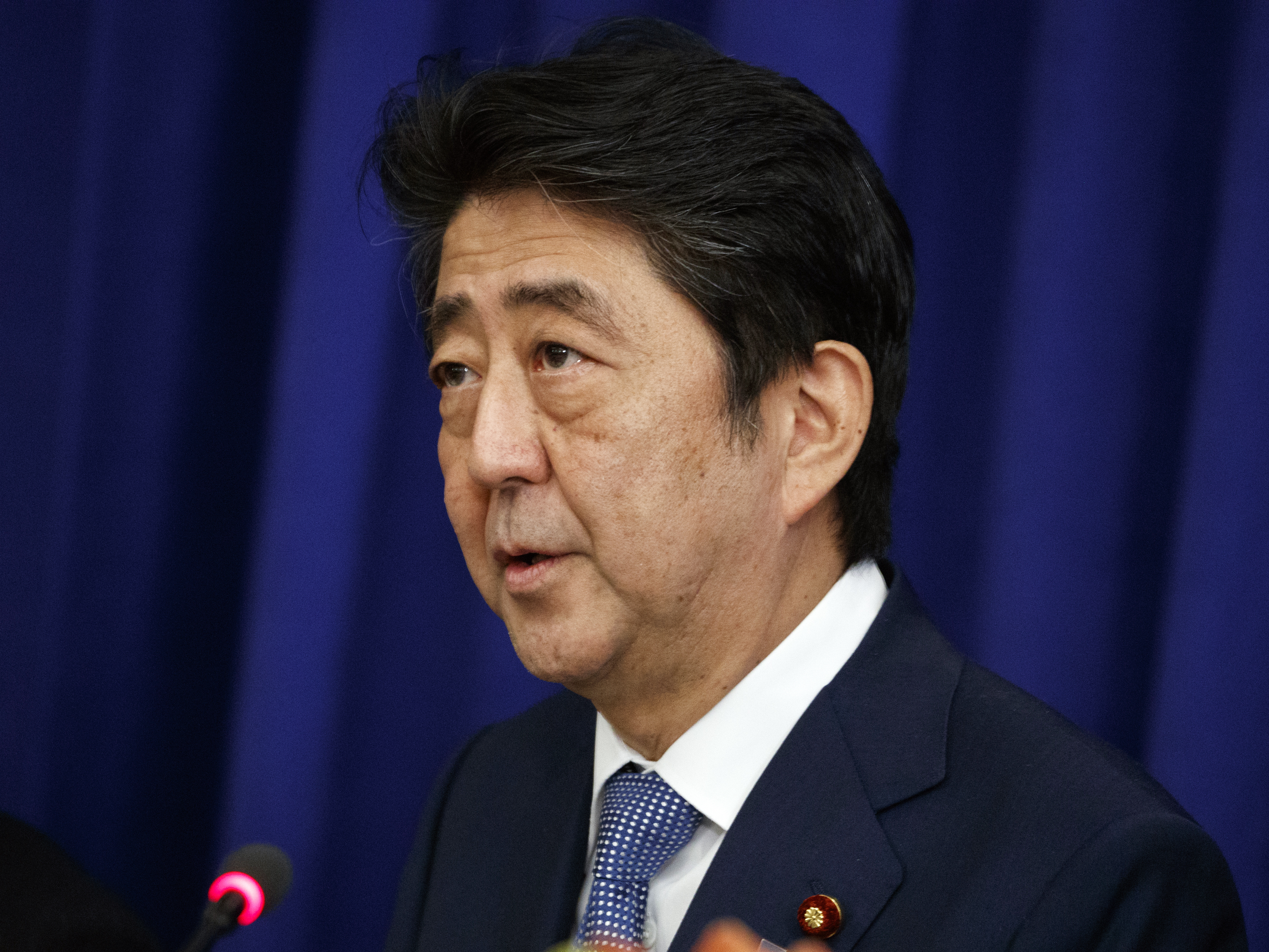 In a photo taken at last year's U.N. General Assembly in New York, Japanese Prime Minister Shinzo Abe speaks at a luncheon with President Donald Trump and South Korean President Moon Jae-in at the Palace Hotel.