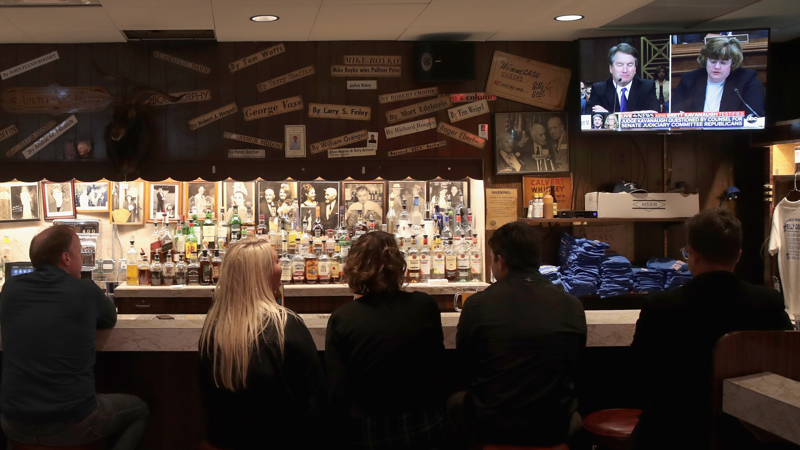 Patrons at Chicago's Billy Goat Tavern watch the Senate Judiciary Committee hearing on sexual abuse allegations against Supreme Court nominee Brett Kavanaugh on Thursday. (Getty Images)