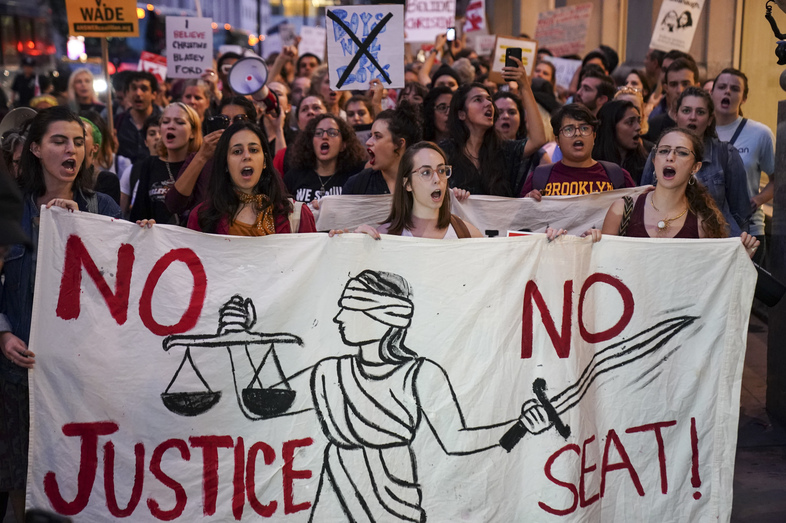 Protesters march through Midtown Manhattan on Monday as they rally against Supreme Court nominee Judge Brett Kavanaugh. (Drew Angerer/Getty Images)