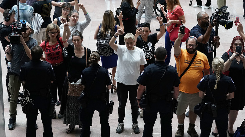 Activists chant during a protest outside the office of Senate Judiciary Committee Chairman Chuck Grassley of Iowa. (Alex Wong/Getty Images)
