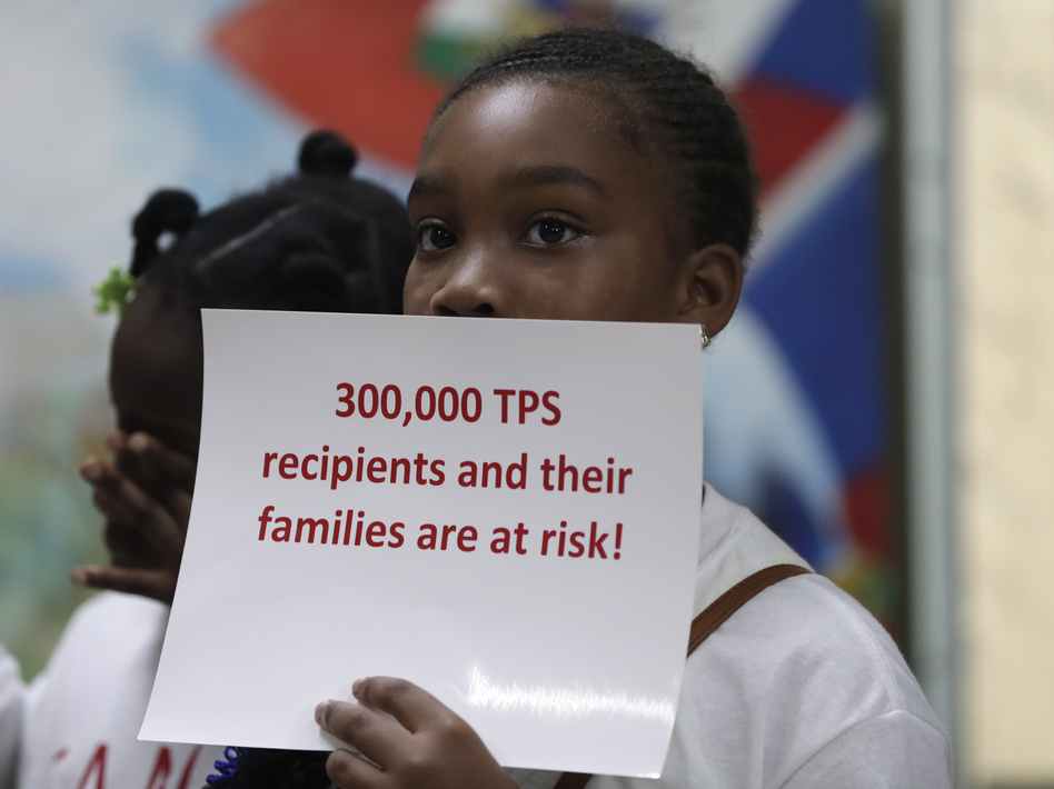 Tarauji Morris listens during a July 2018 news conference where immigration rights supporters urged the Trump administration to extend TPS. (Lynne Sladky/AP)