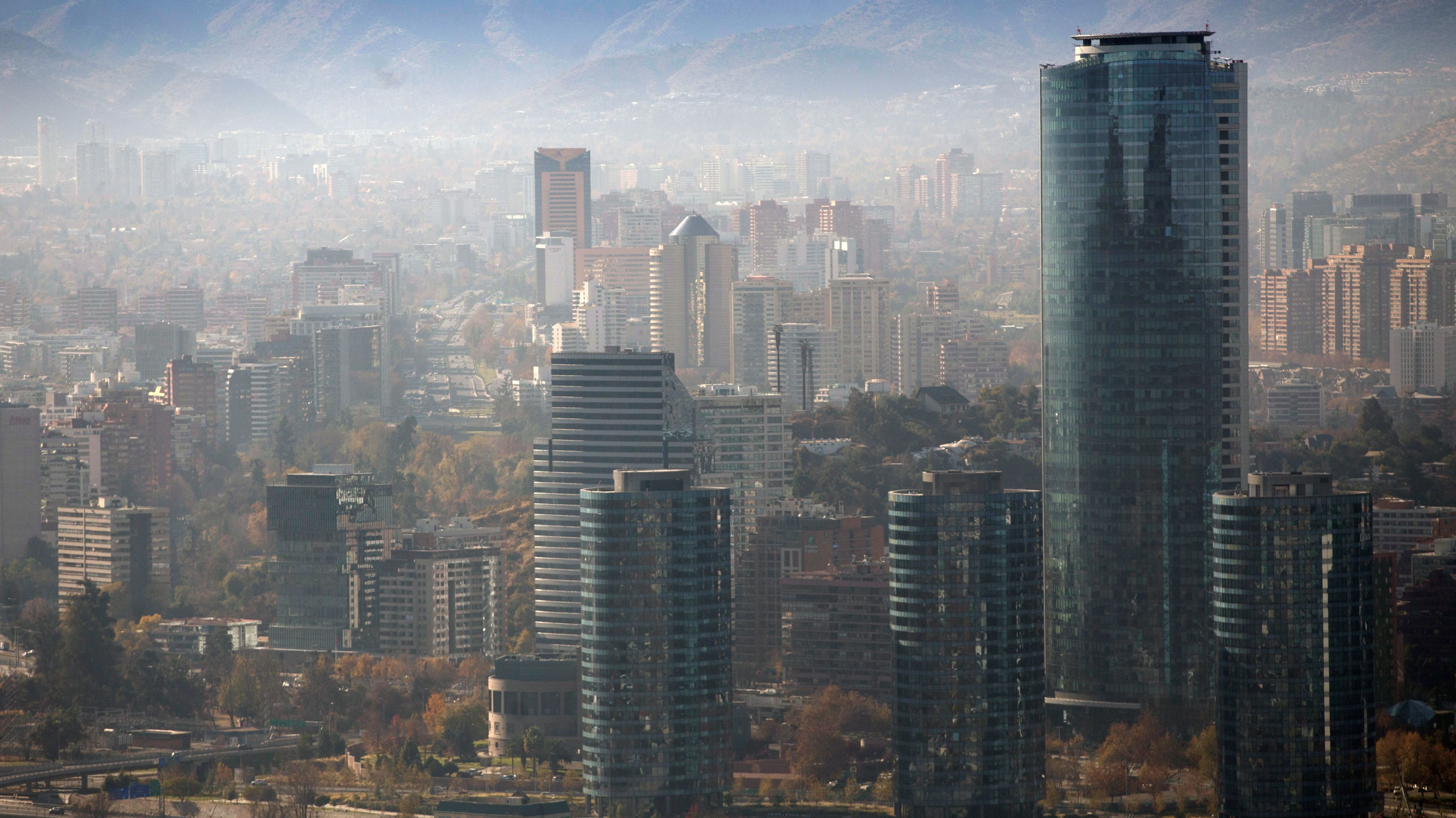 Smog blankets Santiago, Chile, in June. A U.N. report warns that even a 1.5-degree C increase in global temperatures will cause serious changes to weather, sea levels, agriculture and natural eco-systems. (AFP/Getty Images)