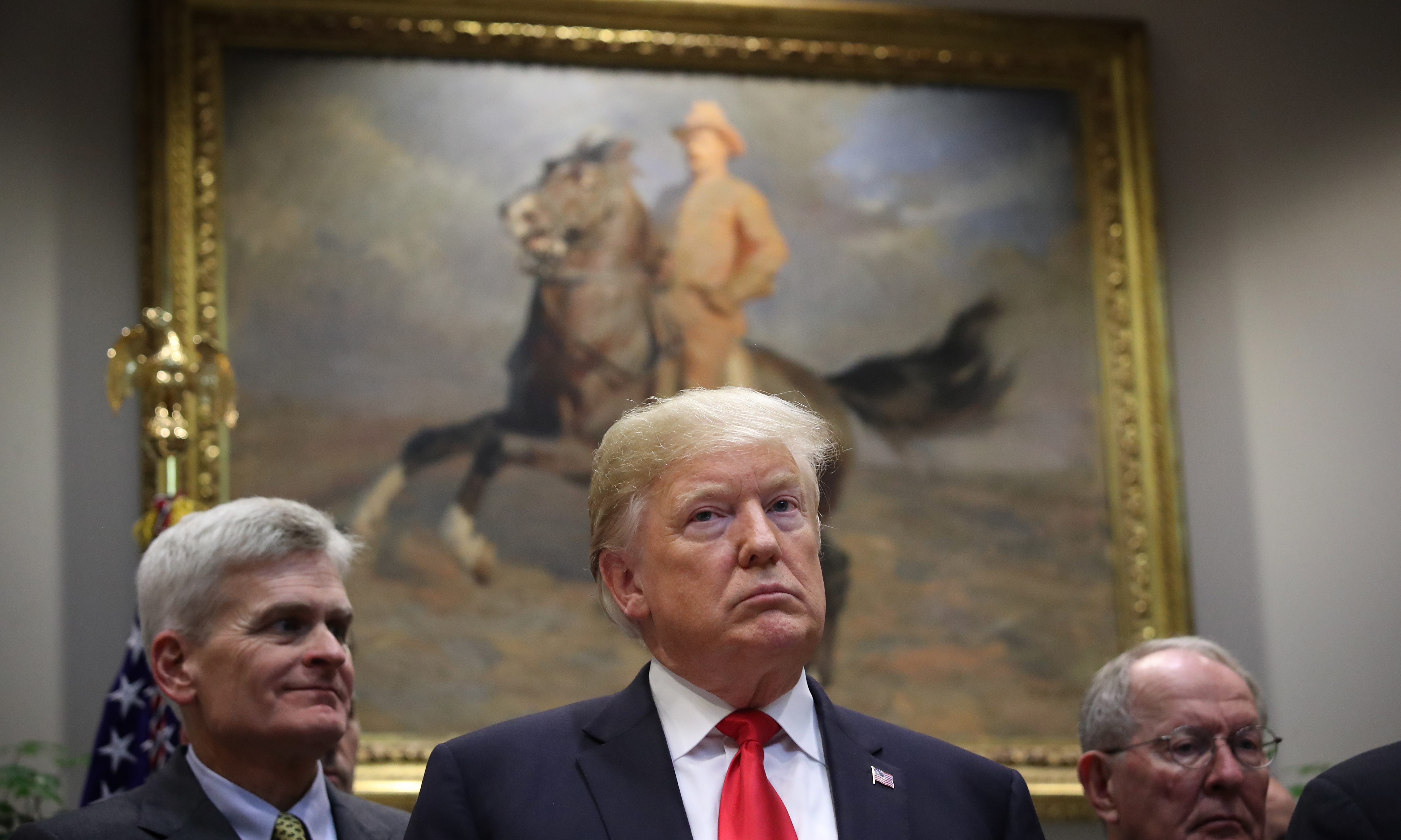 President Trump attends a signing ceremony for health care measures in the Roosevelt Room of the White House on Wednesday, the same day <em>USA Today</em> published an opinion column on the topic by the president. (Getty Images)