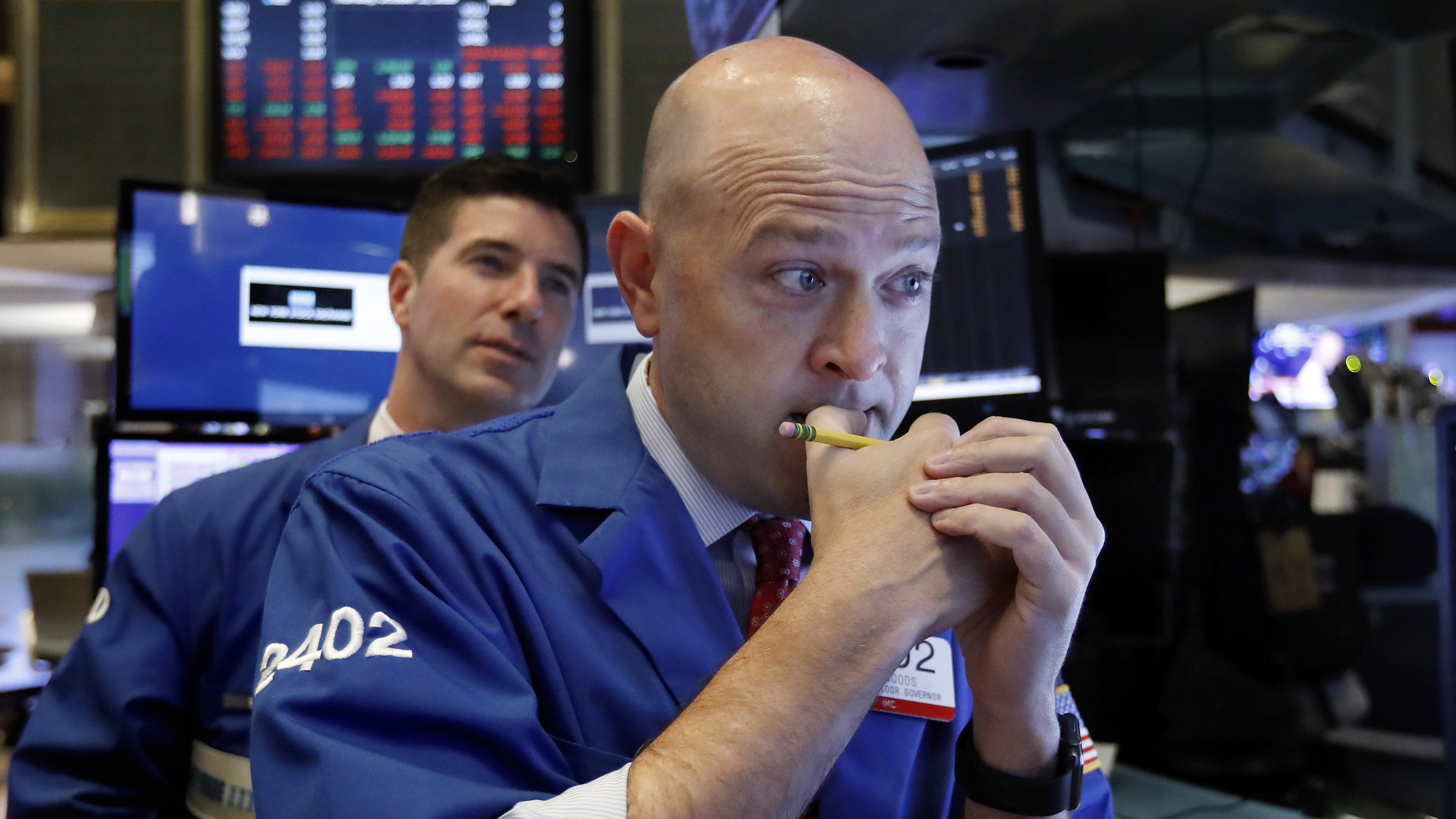 Specialists Jay Woods (right) and Thomas McArdle work on the floor of the New York Stock Exchange on Thursday. The market