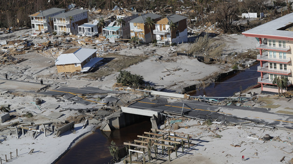 A bridge damaged by Hurricane Michael can be seen Friday in Mexico Beach, Fla. The most powerful hurricane ever known to have hit the Florida Panhandle has left transportation and communication infrastructure in shambles, slowing relief efforts.