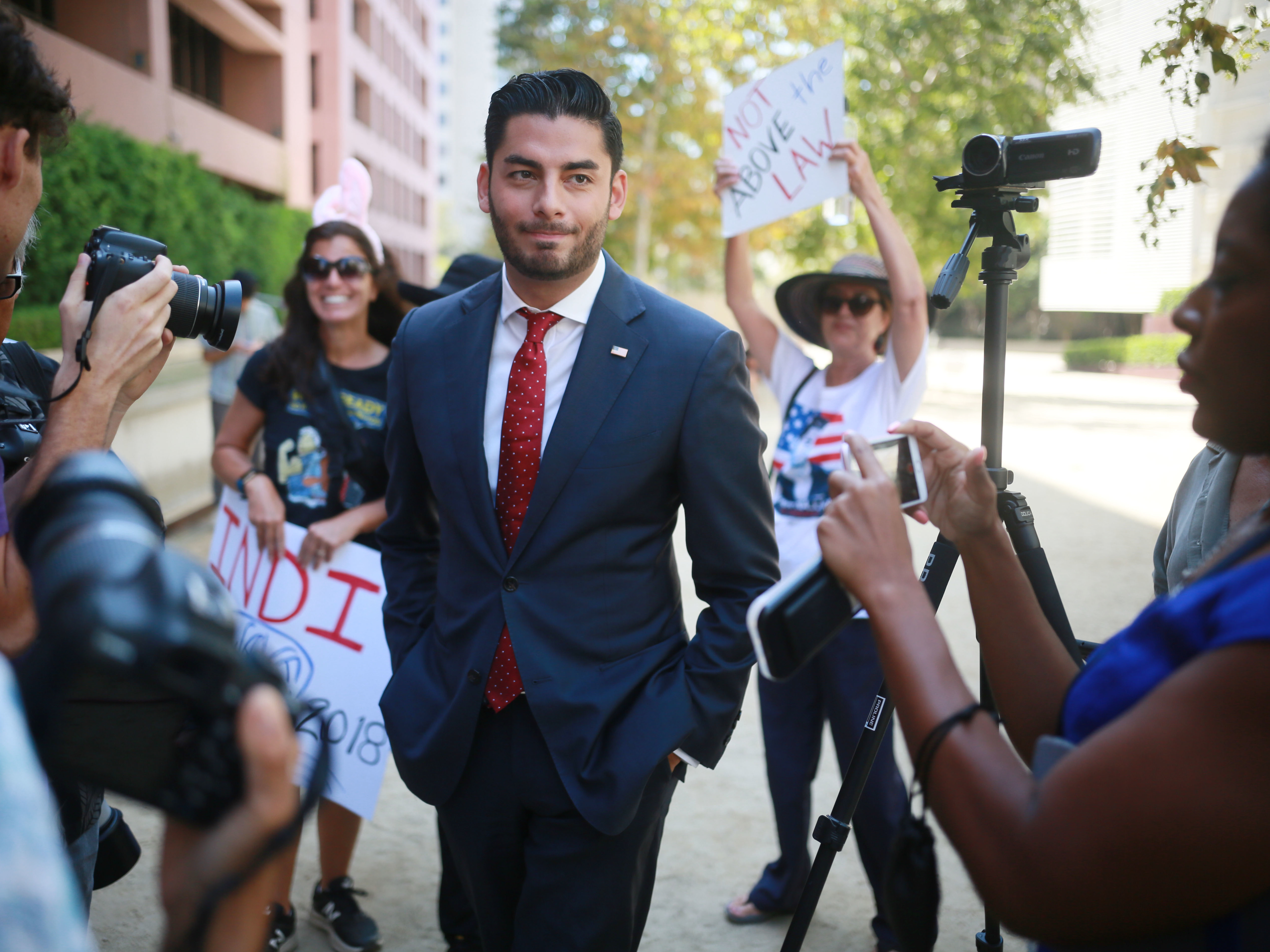GOP Rep. Duncan Hunter, Under Indictment, Launches False Attacks On Opponent 1 Ammar Campa-Najjar, who is running against Republican Rep. Duncan Hunter, speaks to reporters outside the San Diego Federal Courthouse during Hunter's arraignment hearing in August.