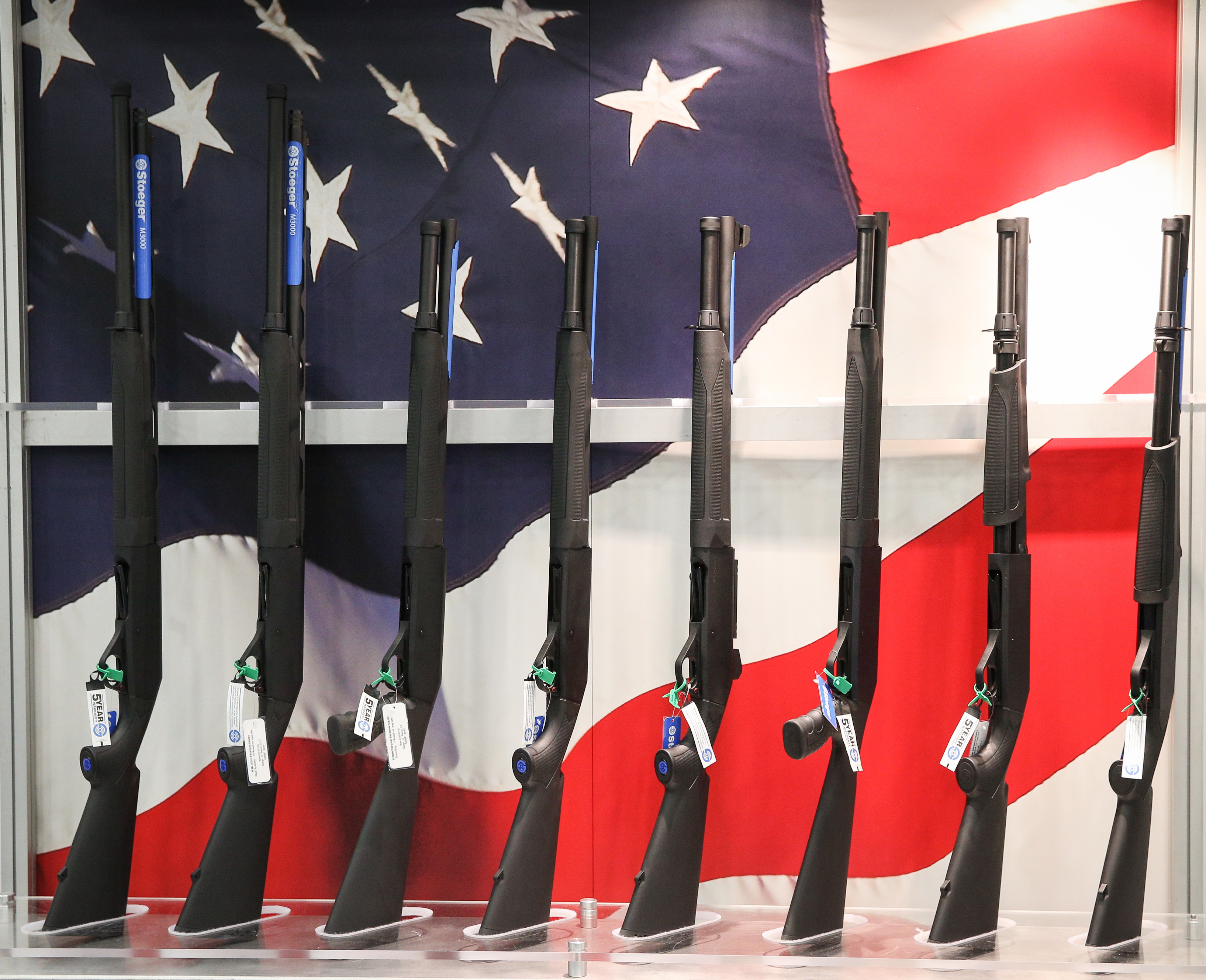 Firearms are exhibited at the annual NRA convention in Dallas this past May. RJ Young's book <em>Let It Bang</em> examines the NRA's relationship with race through his personal, unexpected interest in guns. (AFP/Getty Images)