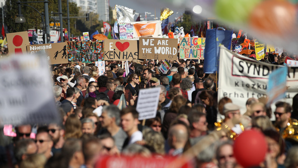 Demonstrators march Saturday in a massive protest against racism in Berlin.