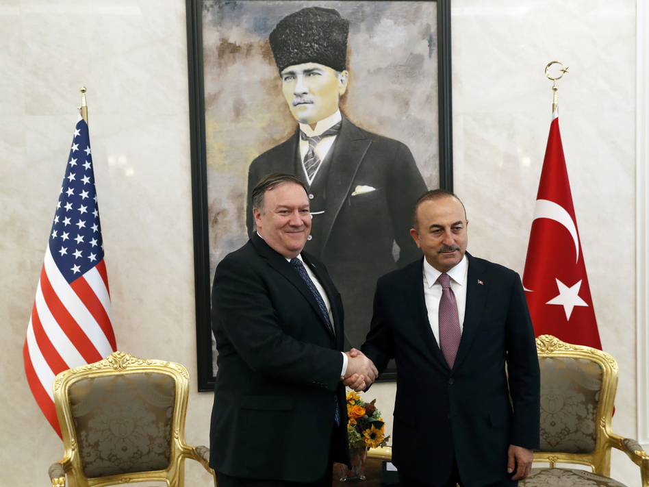 U.S. Secretary of State Mike Pompeo shakes hands with Turkish Foreign Minister Mevlut Cavusoglu before their official talks in Ankara, Turkey, on Wednesday. (Leah Millis/AP)
