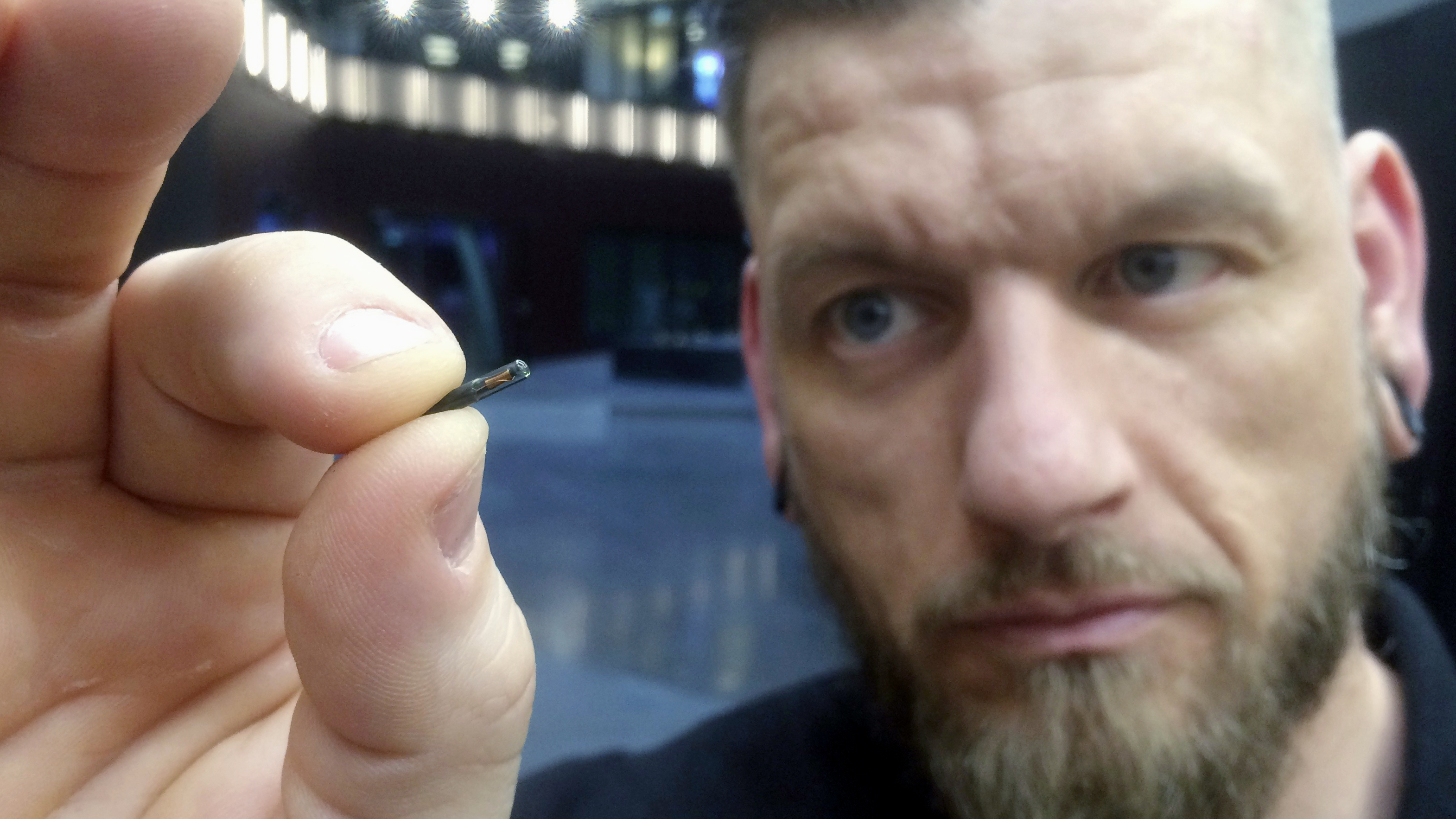 Jowan Österlund holds a microchip implant in Stockholm in 2017. His company, Biohax International, is a leading provider of the devices in Sweden.