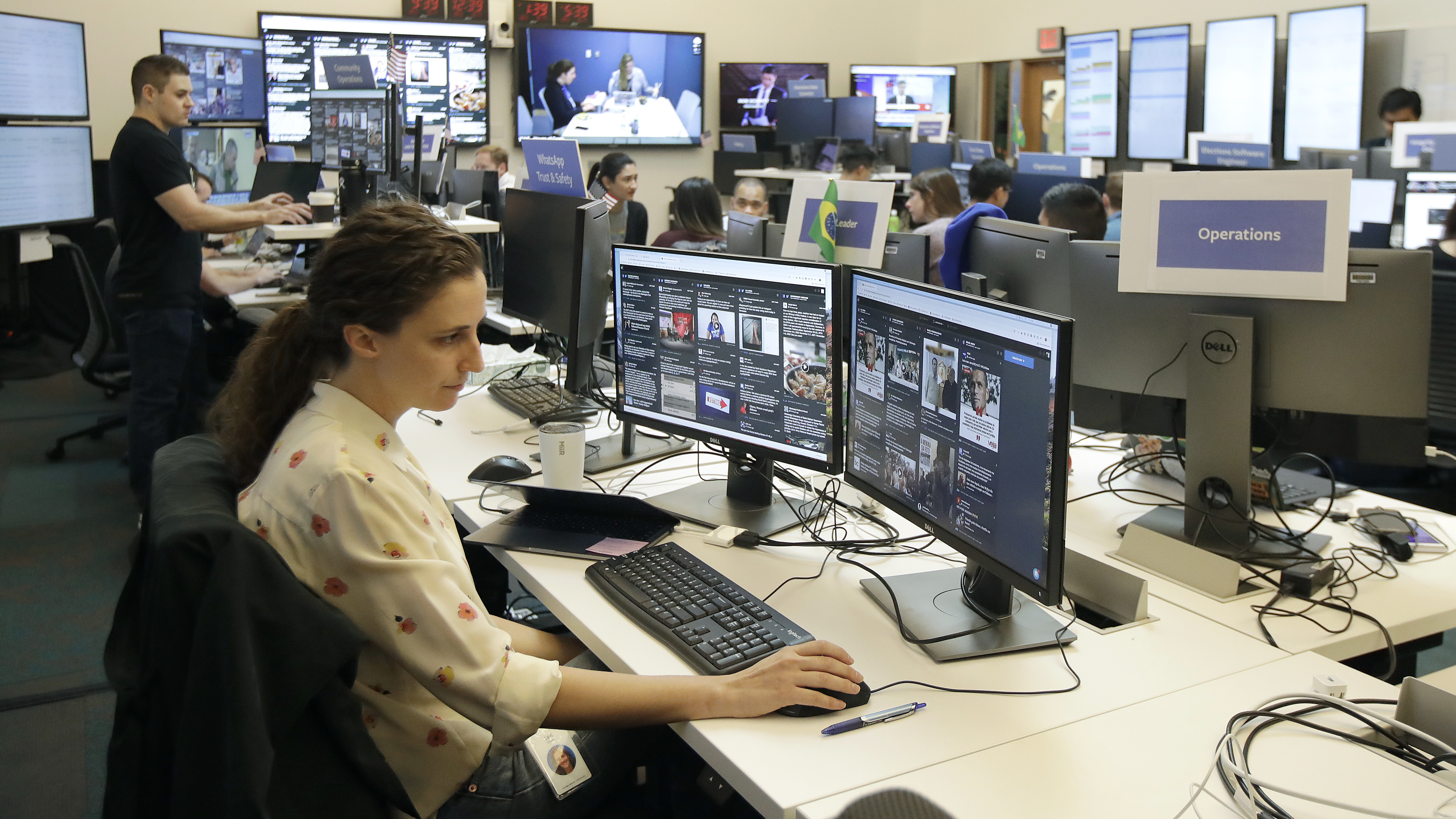 Lexi Sturdy, election war room lead, sits at her desk during a demonstration in the war room, where Facebook monitors election related content on the platform, in Menlo Park, Calif., Wednesday, Oct. 17, 2018.