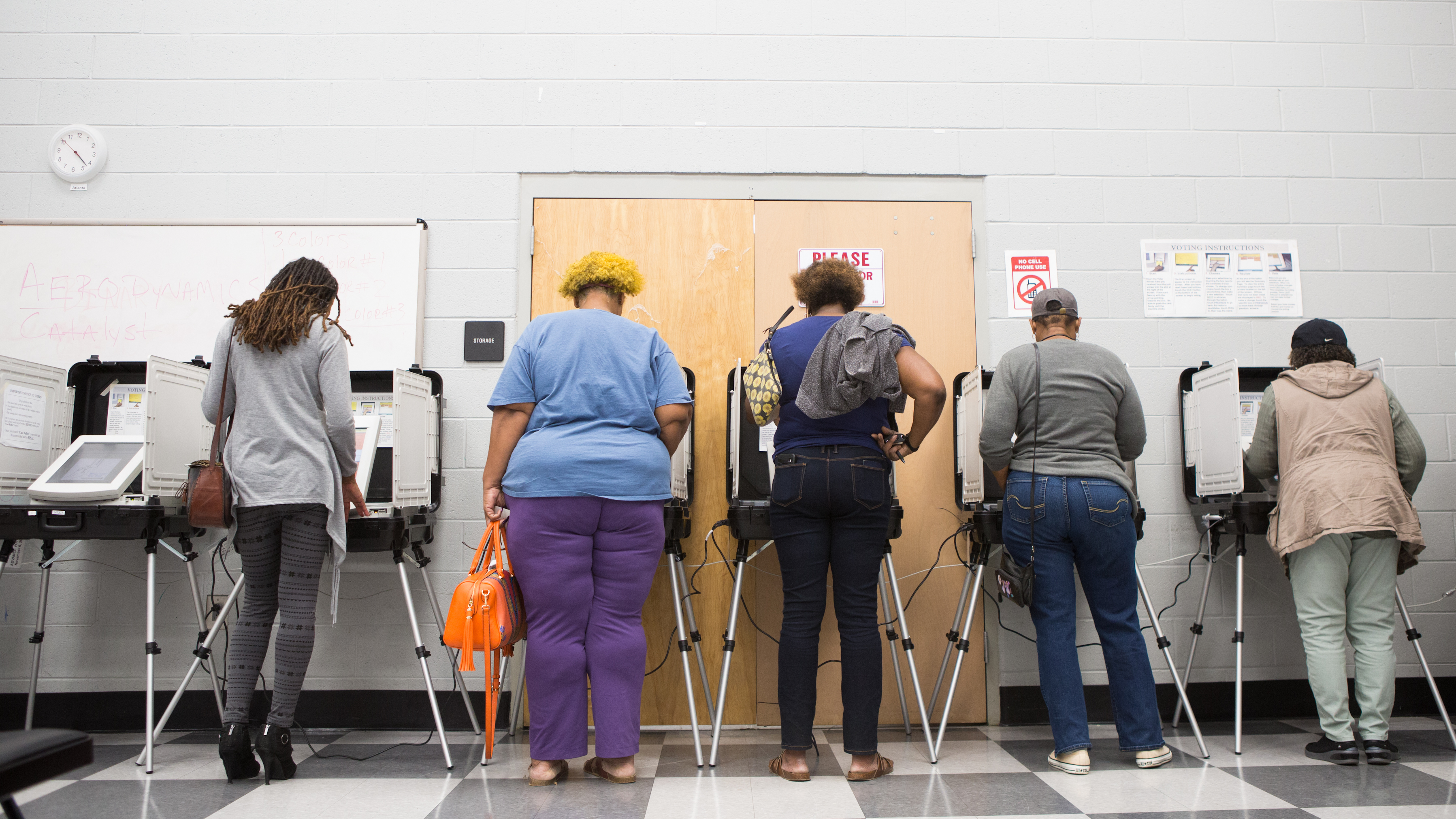 Voters cast ballots during early voting last week in Atlanta. Georgia has blocked approximately 53,000 voter registrations. (Getty Images)