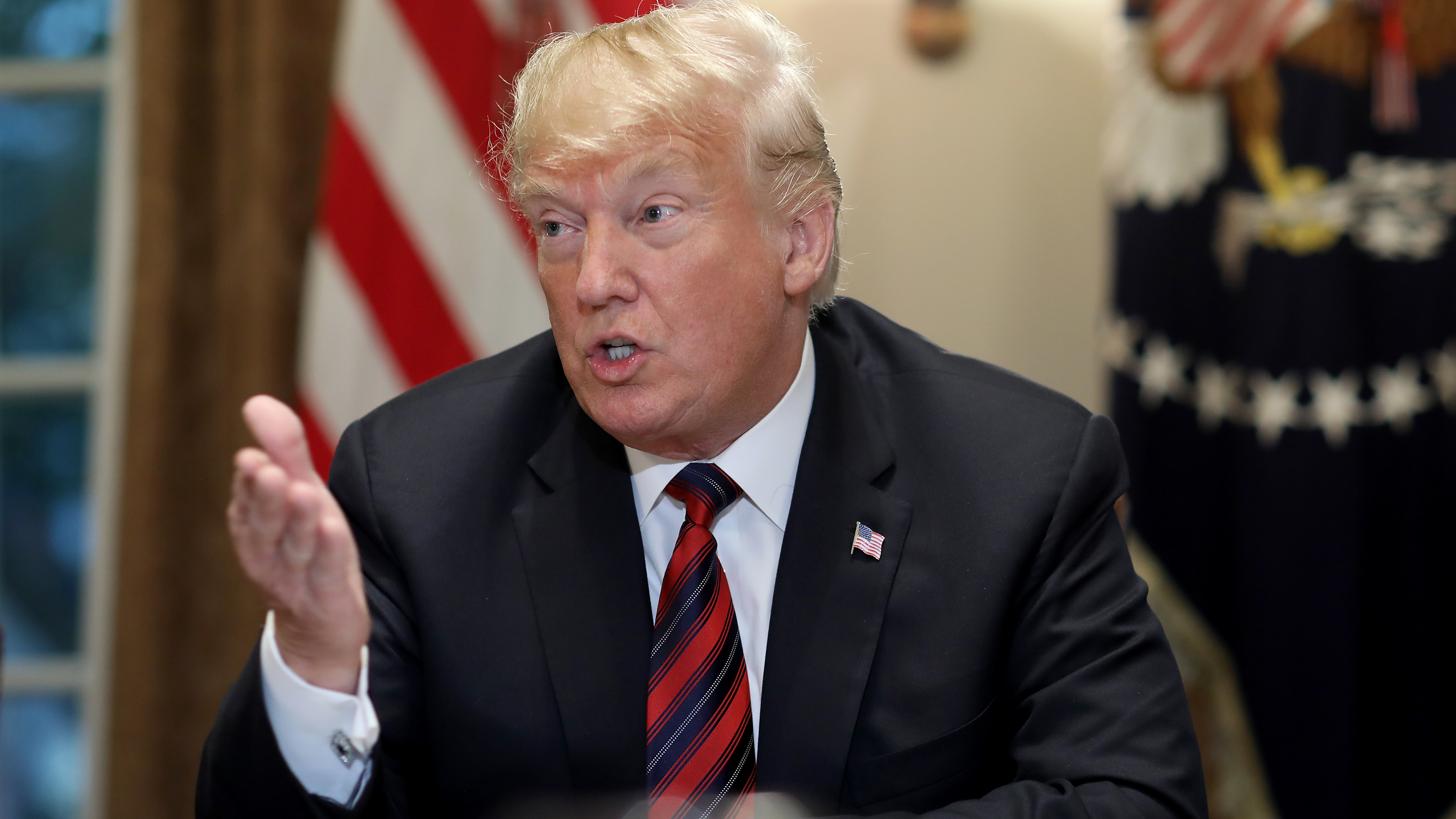 President Trump answers questions during a meeting with military leaders in the Cabinet Room on Tuesday at the White House. (Getty Images)