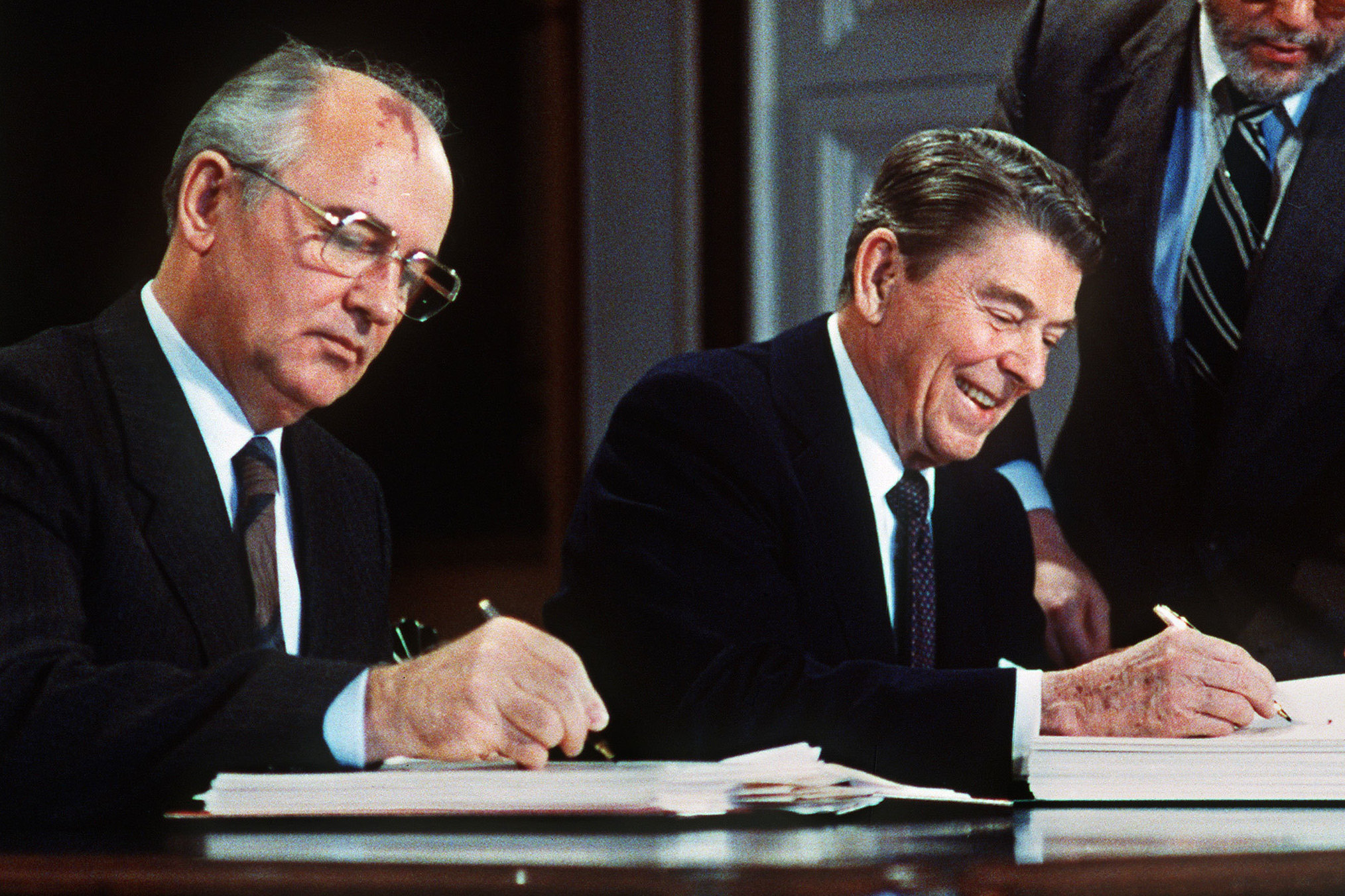 President Ronald Reagan, right, and Soviet leader Mikhail Gorbachev sign the Intermediate-Range Nuclear Forces Treaty in the White House East Room on December 8, 1987. (Getty Images)