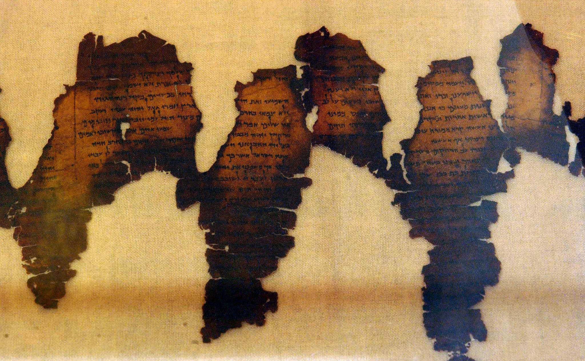 Fragments of the Dead Sea Scrolls are displayed in 2003 at Montreal's Pointe-a-Callieres archaeology museum. Five forged fragments of the scroll were previously displayed at the Museum of the Bible.