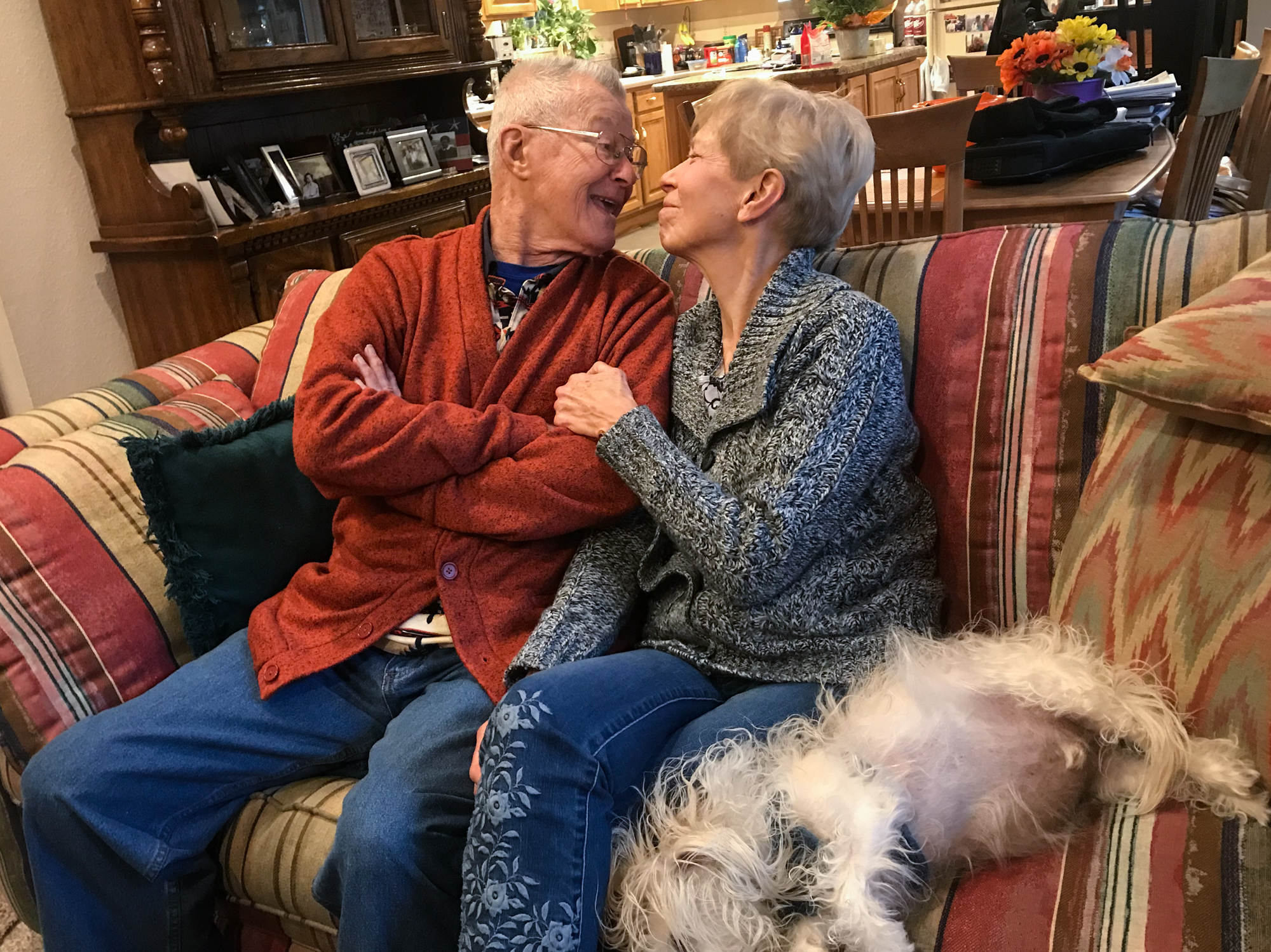 Ed, Kathy and their dog Charlie at home in Aurora, Colo.
